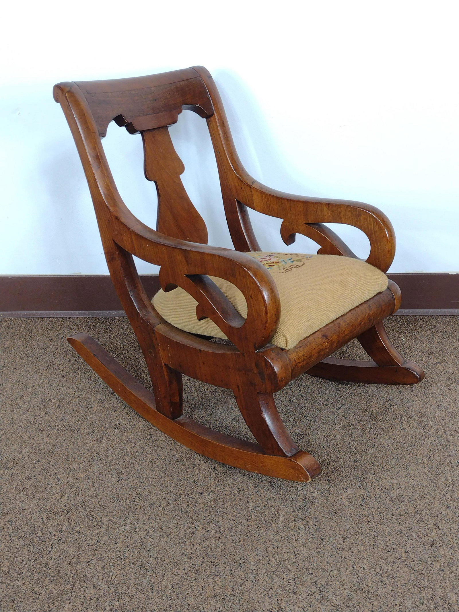 Child's Rocker With Needlepoint Seat: Retailed by J.W. Whary, Shamokin Pa. 14" wide X 23" deep X 21" high. IMPORTANT: Before bidding, please read the terms and conditions. When you registered for the auction you agreed to these terms and 