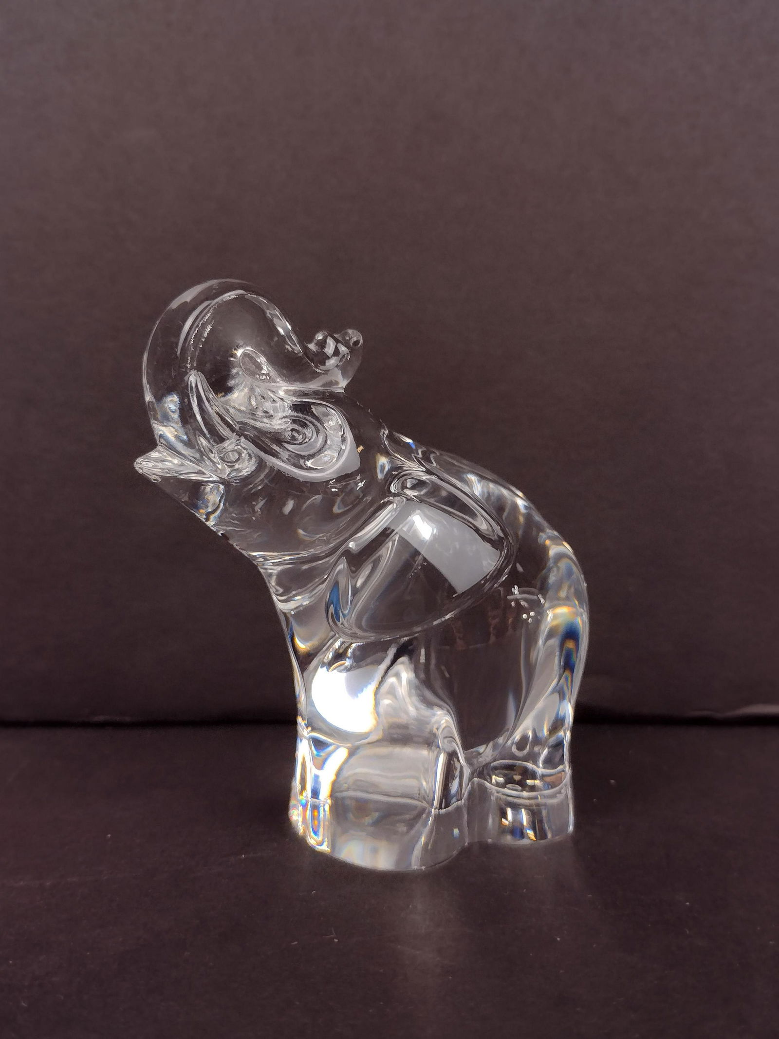 Steuben Elephant Figurine: Signed to bottom. 4-1/4" high x 3" wide. IMPORTANT: Before bidding, please read the terms and conditions. When you registered for the auction you agreed to these terms and will be required to comply w