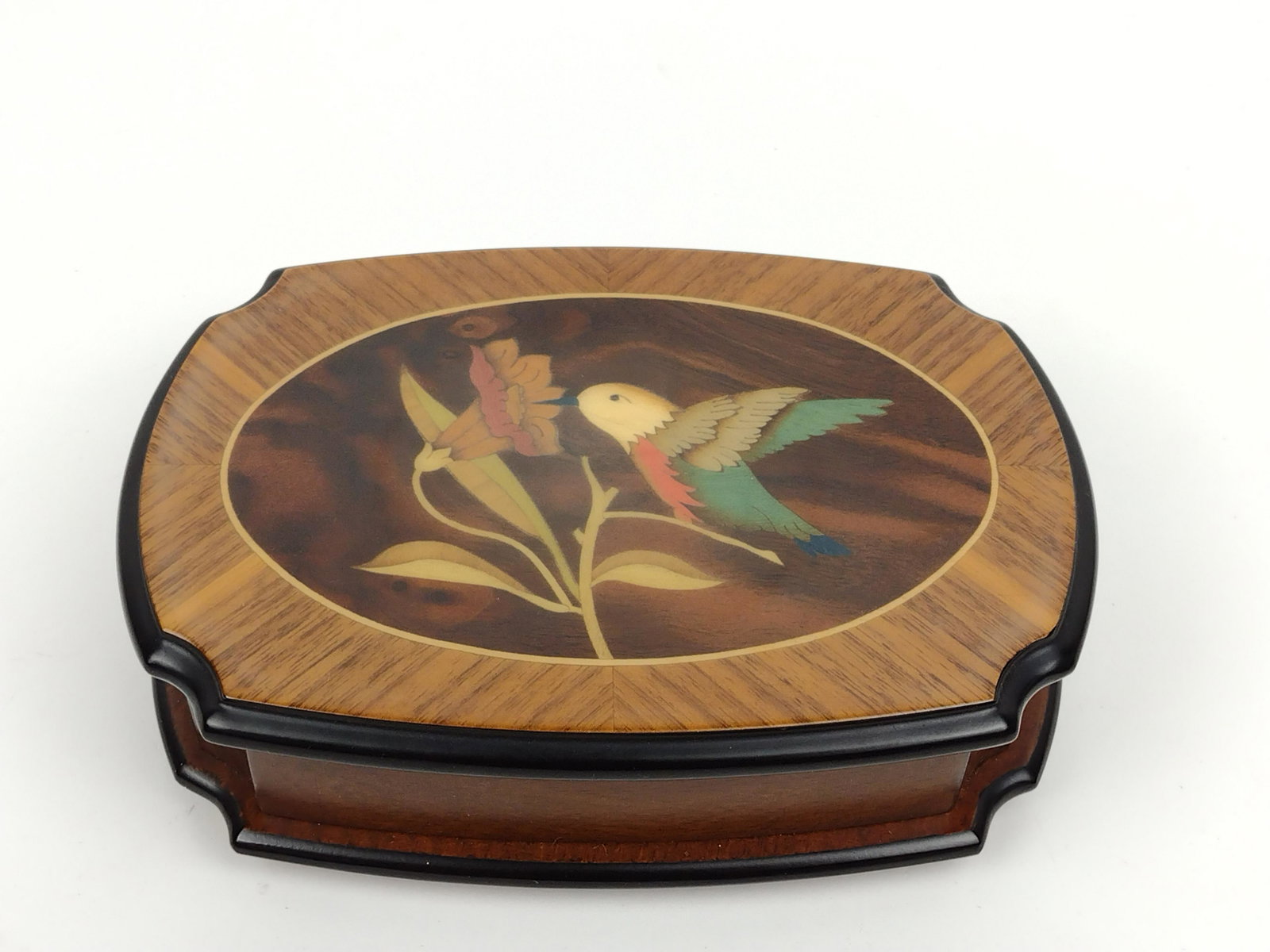 Reuge Hummingbird Decorated Music Box: Works. Plays Waltz of the Flowers. 4-3/4" high x 6-1/2" wide. IMPORTANT: Before bidding, please read the terms and conditions. When you registered for the auction you agreed to these terms and will be