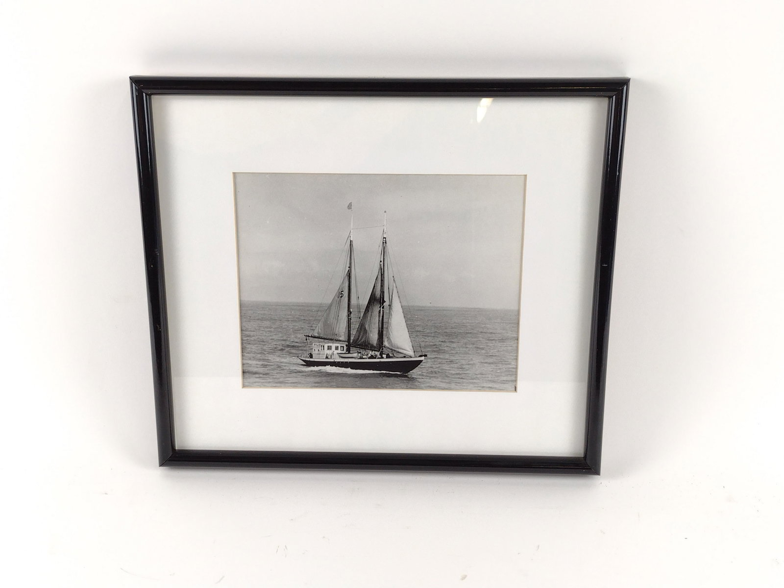 Photograph of San Francisco Pilot Boat: Handwritten on back "This is the pilot boat helmed by Captain William Scorah who was Harbormasters of San Francisco Bay in the 1940's". 15" wide x 13" high. Slight paint loss to frame. IMPORTANT: Befo