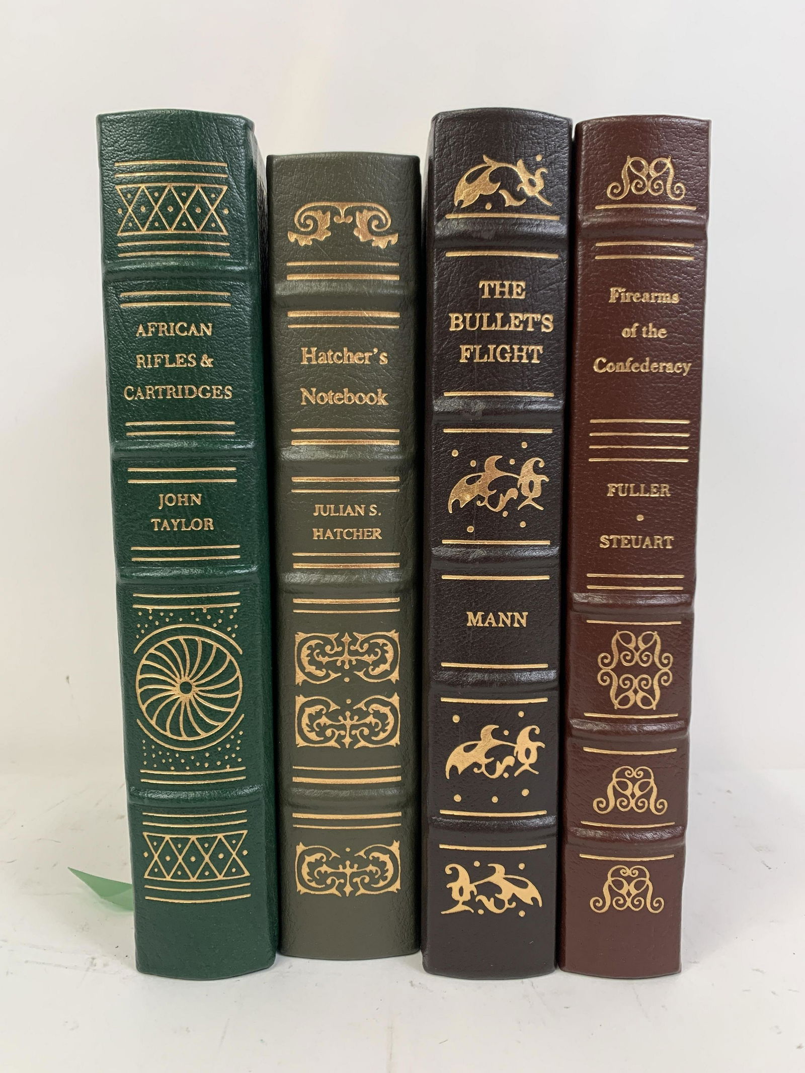4 NRA Library Firearm Books: Includes African Rifles and Cartridges by John Taylor, Hatcher’s Notebook by Julian S. Hatcher, The Bullets Flight by F. W. Mann, and Firearms of the Confederacy by Claud E. Fuller and Richard D. St