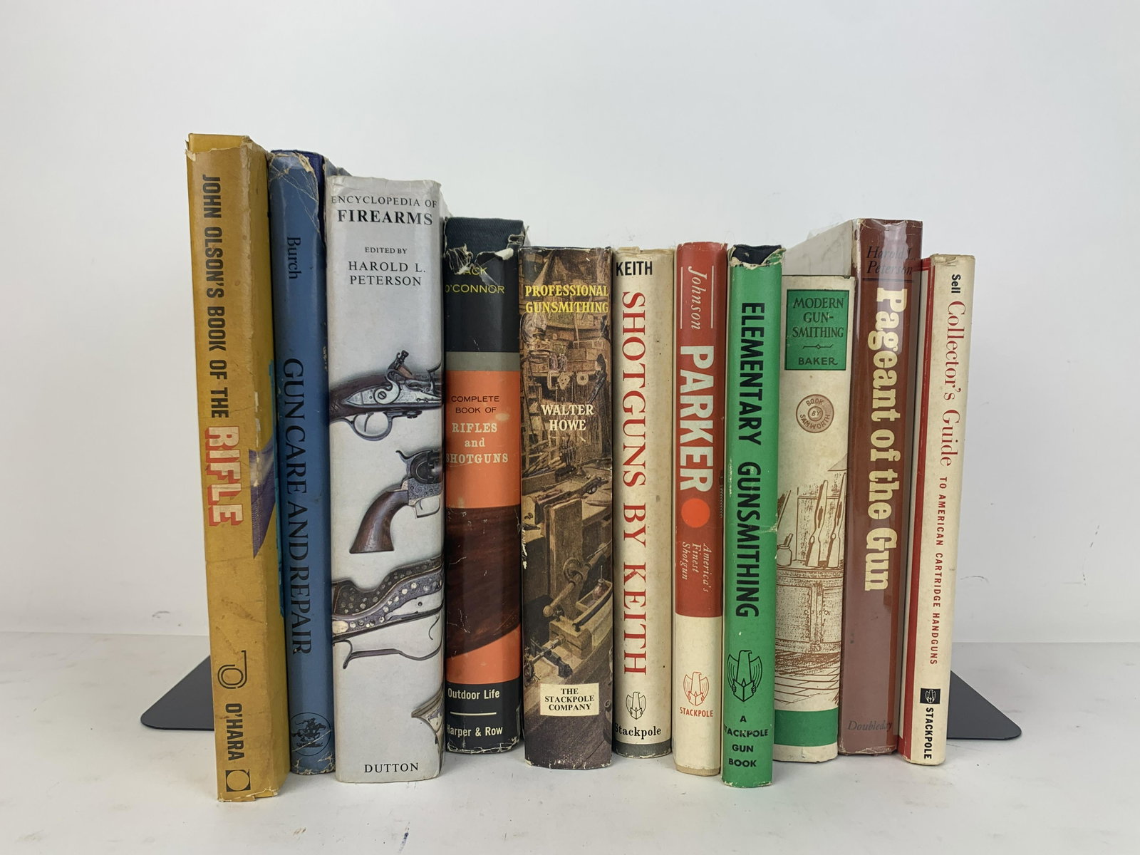 11 Books on Firearms & Gunsmithing: Includes John Olson's Book of the Rifle, Complete Book of Rifles and Shotguns, Encyclopedia of Firearms, Gun Care and Repair, Collector's Guide to American Cartridge Handguns, Pageant of the Gun, Mode
