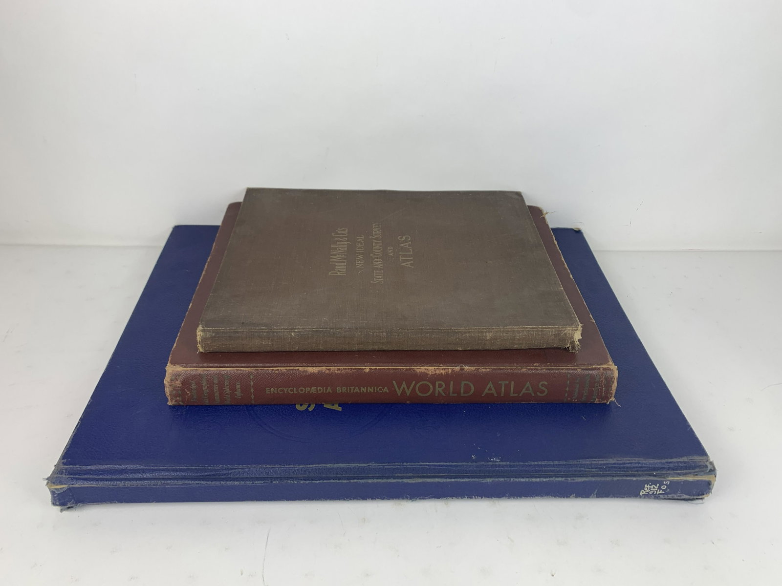 3 Large Atlases: Includes the Encyclopaedia Britannica World Atlas, Rand, McNally & Co.'s New Ideal State and County Survey and Atlas, and School and Library Atlas of the World. From the Estate of Stephen Pancoe, York
