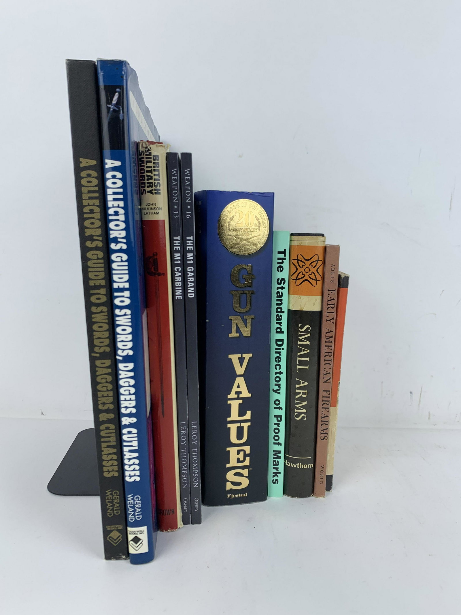 10 Books on Firearms & Weaponry: Includes two copies of A Collector's Guide to Swords, Daggers & Cutlass, British Military Swords, The M1 Carbine, The M1 Garand, Gun Values, The Standard Directory of Proof Marks, Small Arms, Early Am