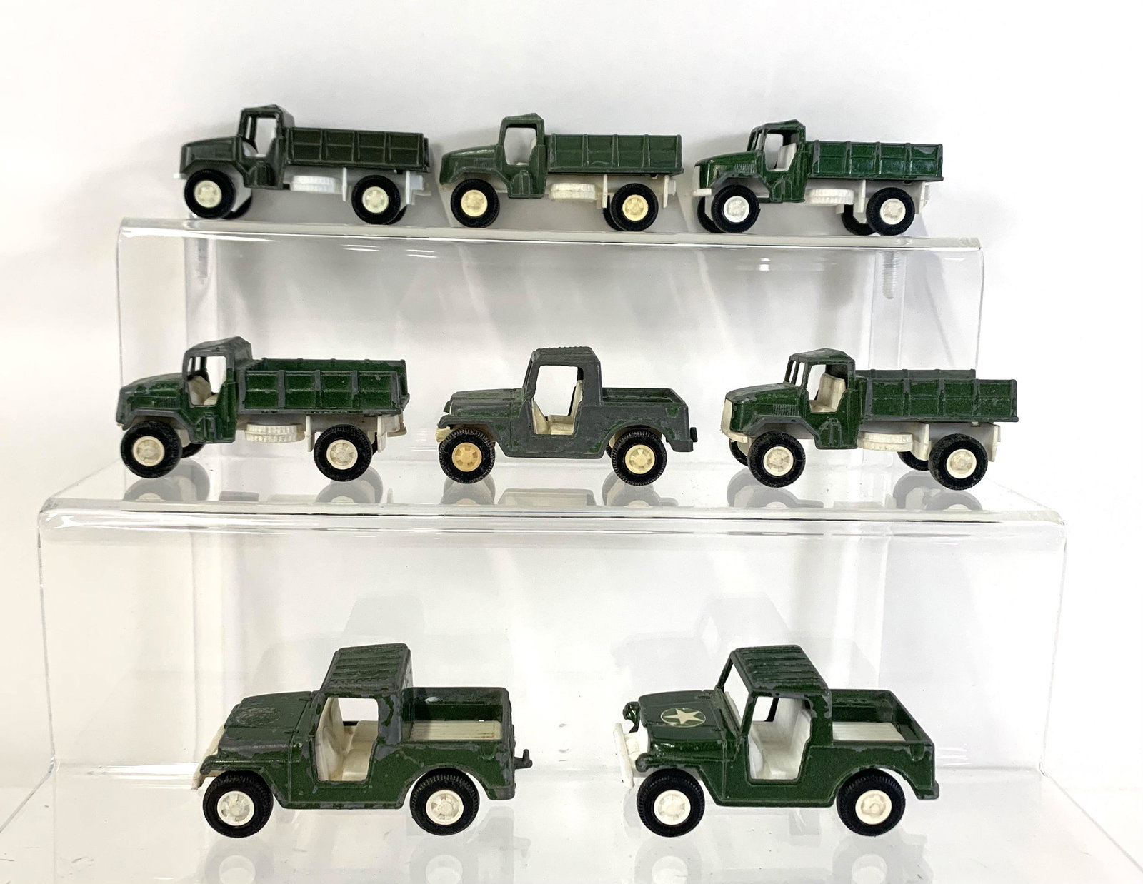 8 Tootsietoy Military Trucks: From the Estate of Stephen Pancoe, York Haven, PA. IMPORTANT: Before bidding, please read the terms and conditions. When you registered for the auction you agreed to these terms and will be required t