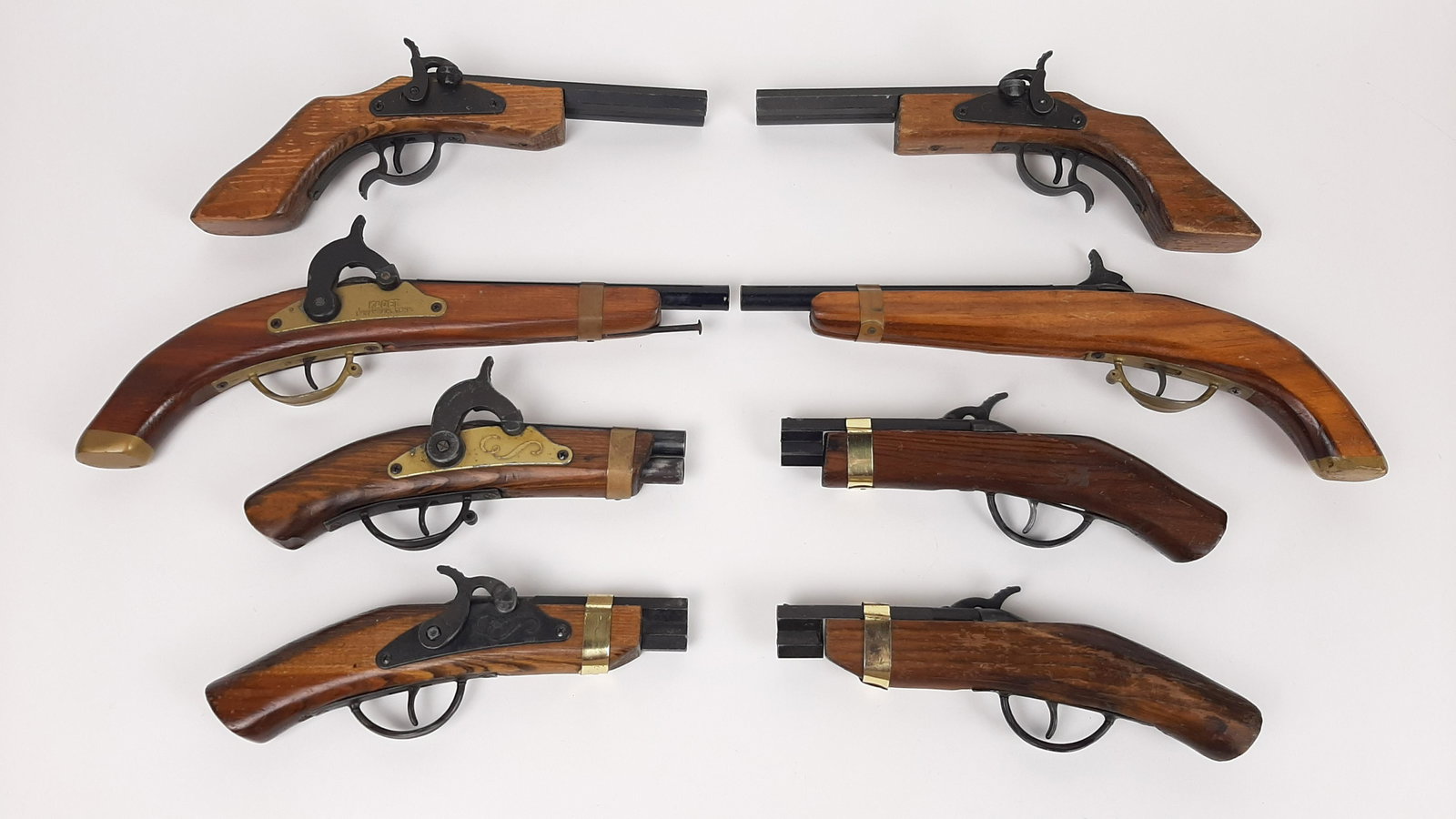 4 Pr Replica Dueling Pistols incl. Parris: Also includes Kadet. 9" to 13-1/2" long. From the Estate of Stephen Pancoe, York Haven, PA. IMPORTANT: Before bidding, please read the terms and conditions. When you registered for the auction you agr