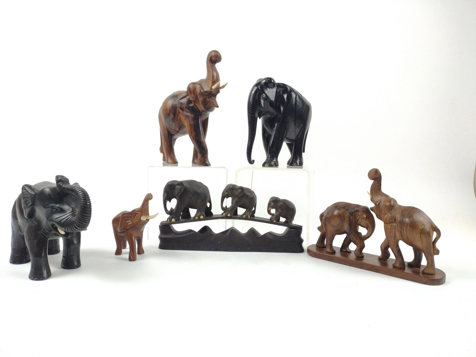 6 Wooden Elephant Figurines: 4-3/4" to 7-3/4" high x 3-1/2" to 9" wide. Some losses. From the Estate of Stephen Pancoe, York Haven, PA. IMPORTANT: Before bidding, please read the terms and conditions. When you registered for the 