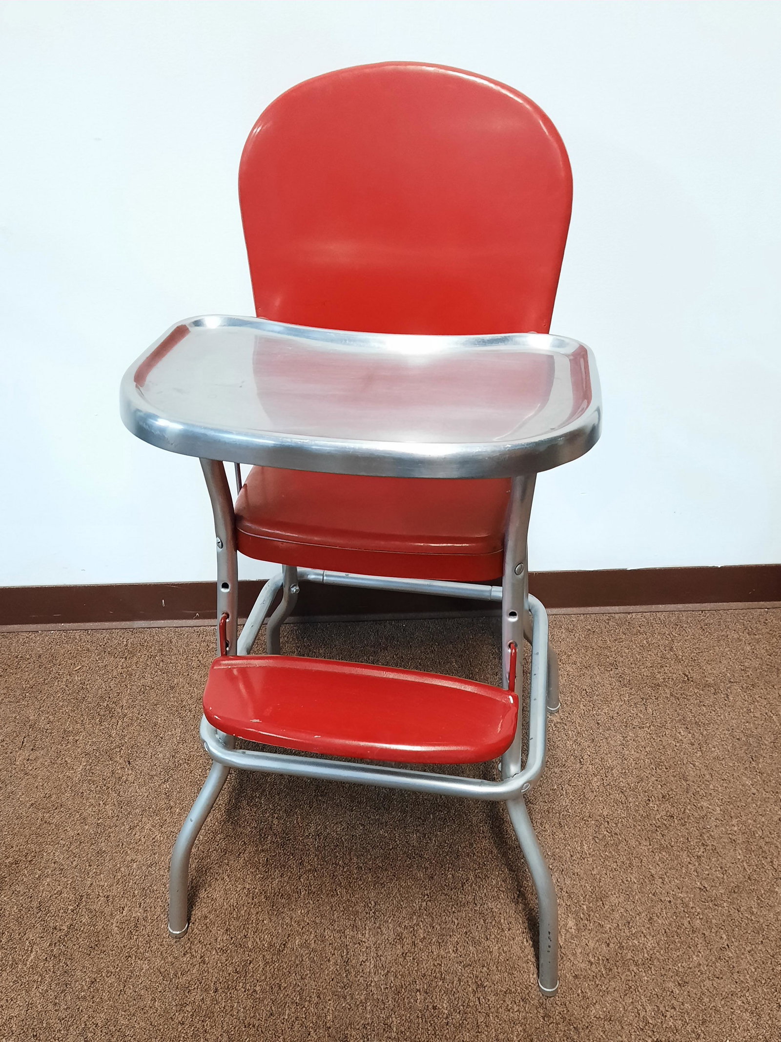 Retro Red/Chrome High Chair: 20" wide X 20" deep X 38" high. Some discoloration and paint loss. IMPORTANT: Before bidding, please read the terms and conditions. When you registered for the auction you agreed to these terms and wi