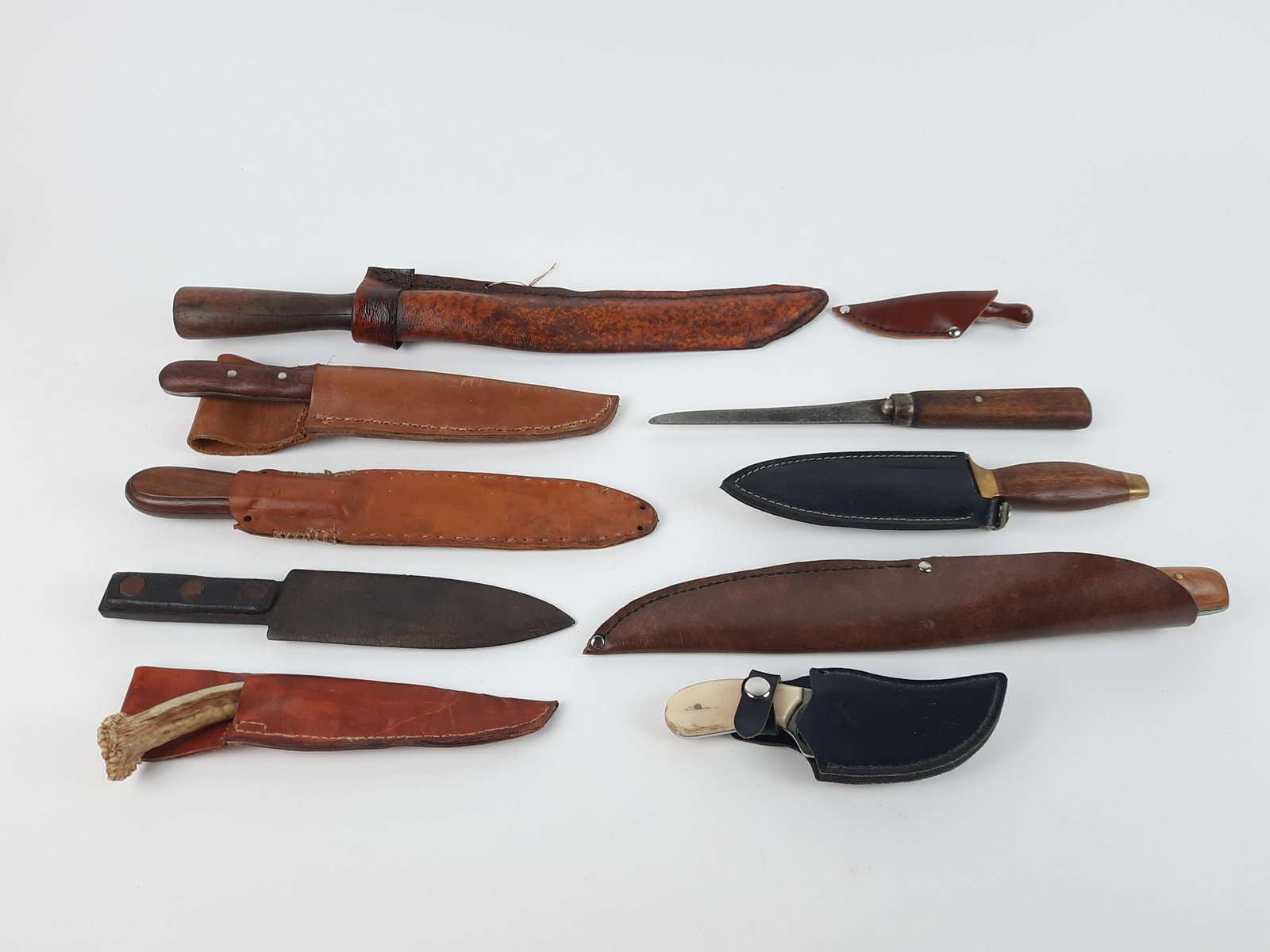 10 Sheath Knives: 5" to 16" total length. From the Estate of Stephen Pancoe, York Haven, PA. IMPORTANT: Before bidding, please read the terms and conditions. When you registered for the auction you agreed to these term