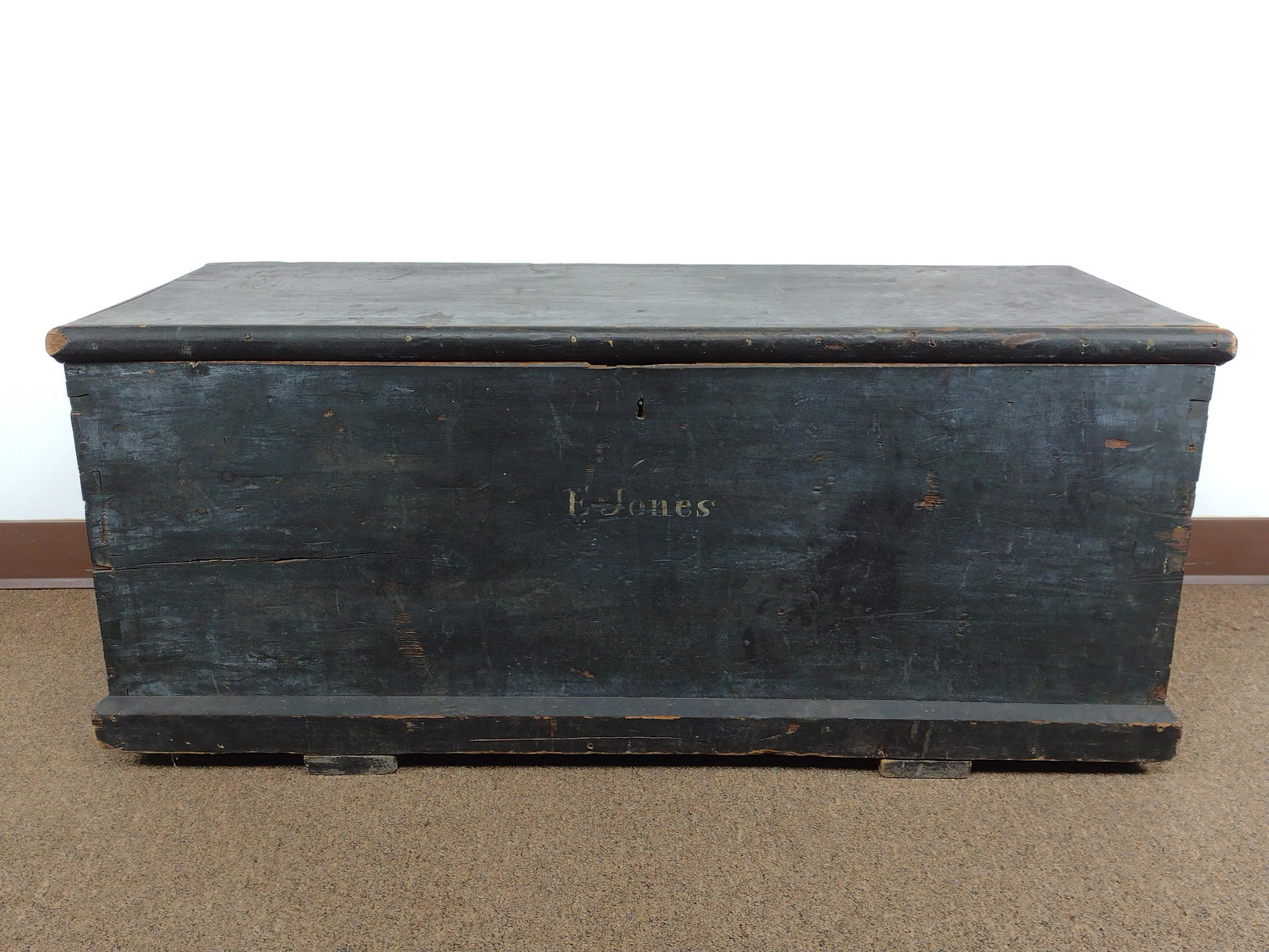 E Jones Painted Blanket Chest: 44 1/2" wide X 18" deep X 19" high. Has some cracks. One hinge not attached to base. From the Estate of Stephen Pancoe, York Haven, PA. IMPORTANT: Before bidding, please read the terms and conditions.
