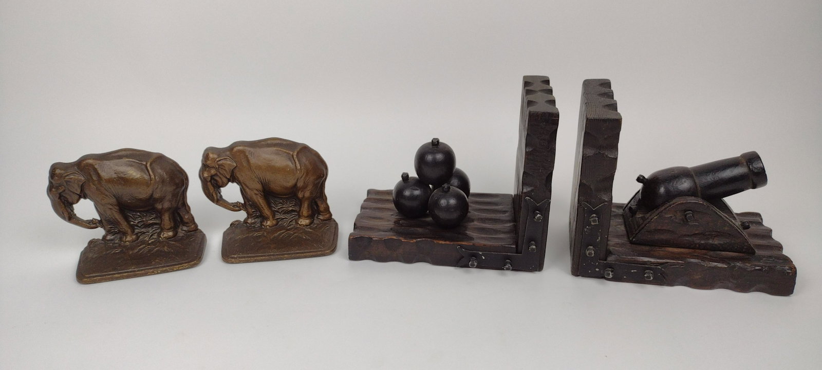 4 Cannon and Elephant Bookends: 4-1/2" to 5" wide X 4-1/2" to 6-1/2" high. From the Estate of Stephen Pancoe, York Haven, PA. IMPORTANT: Before bidding, please read the terms and conditions. When you registered for the auction you a
