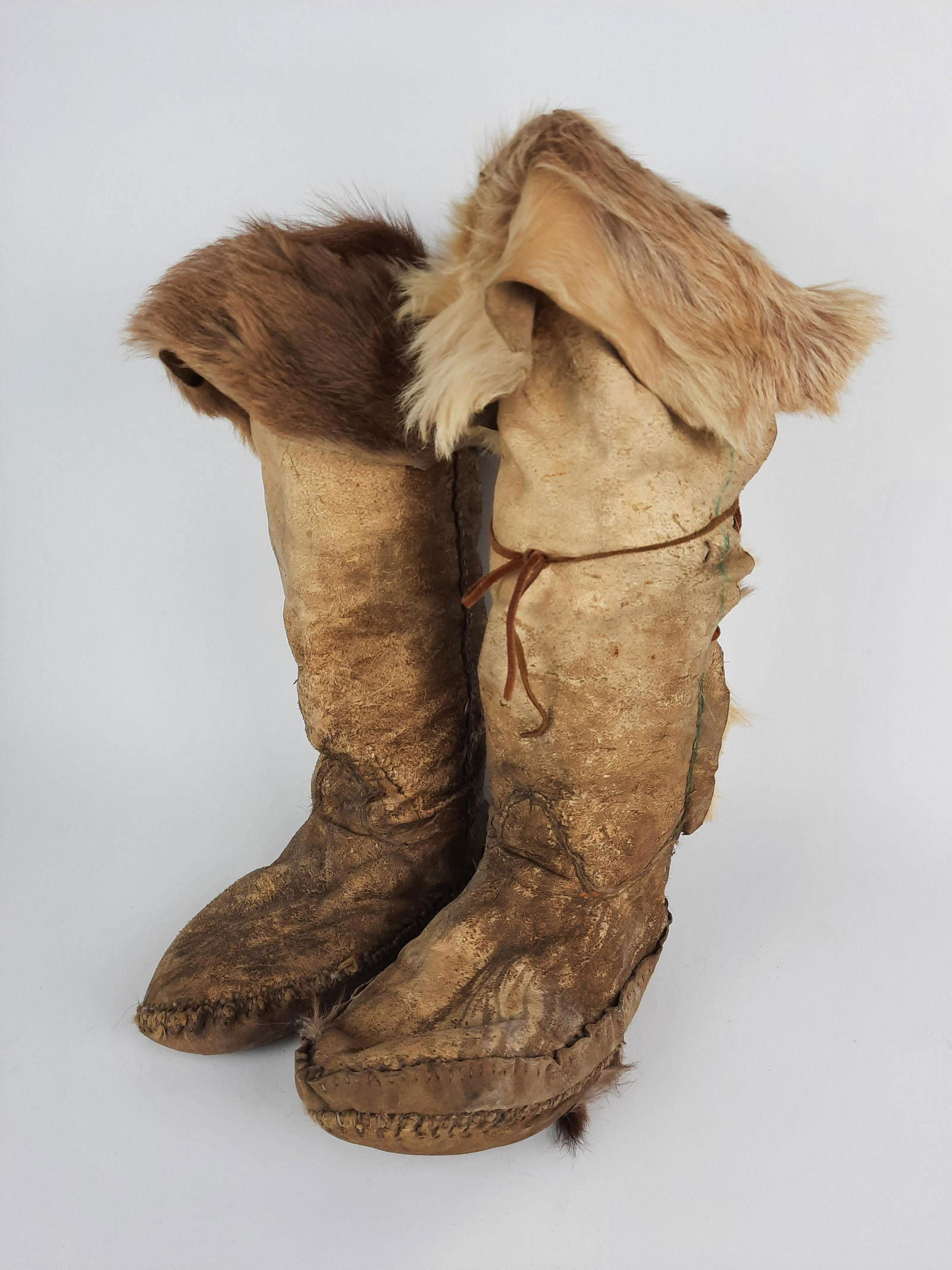 Deer Skin Moccasin Boots: Foot total length 12" long x 17" high. Some wear. From the Estate of Stephen Pancoe, York Haven, PA. IMPORTANT: Before bidding, please read the terms and conditions. When you registered for the auctio
