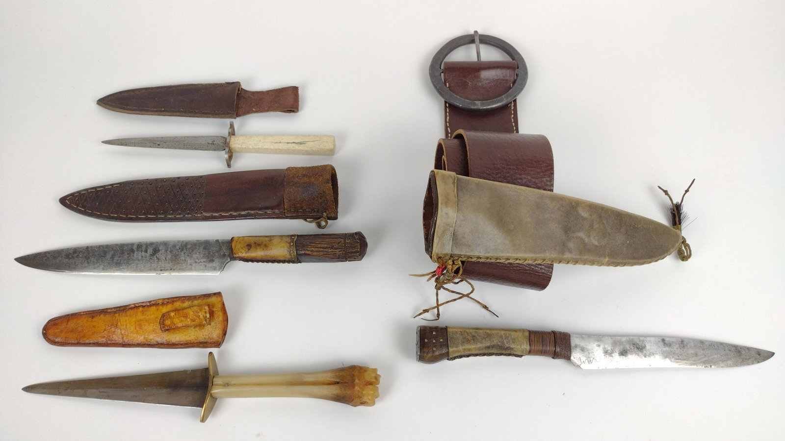 4 Knives incl Bone-Handled: All with sheaths including leather belt. 11-1/4" to 13-3/4" long. From the Estate of Stephen Pancoe, York Haven, PA. IMPORTANT: Before bidding, please read the terms and conditions. When you registere