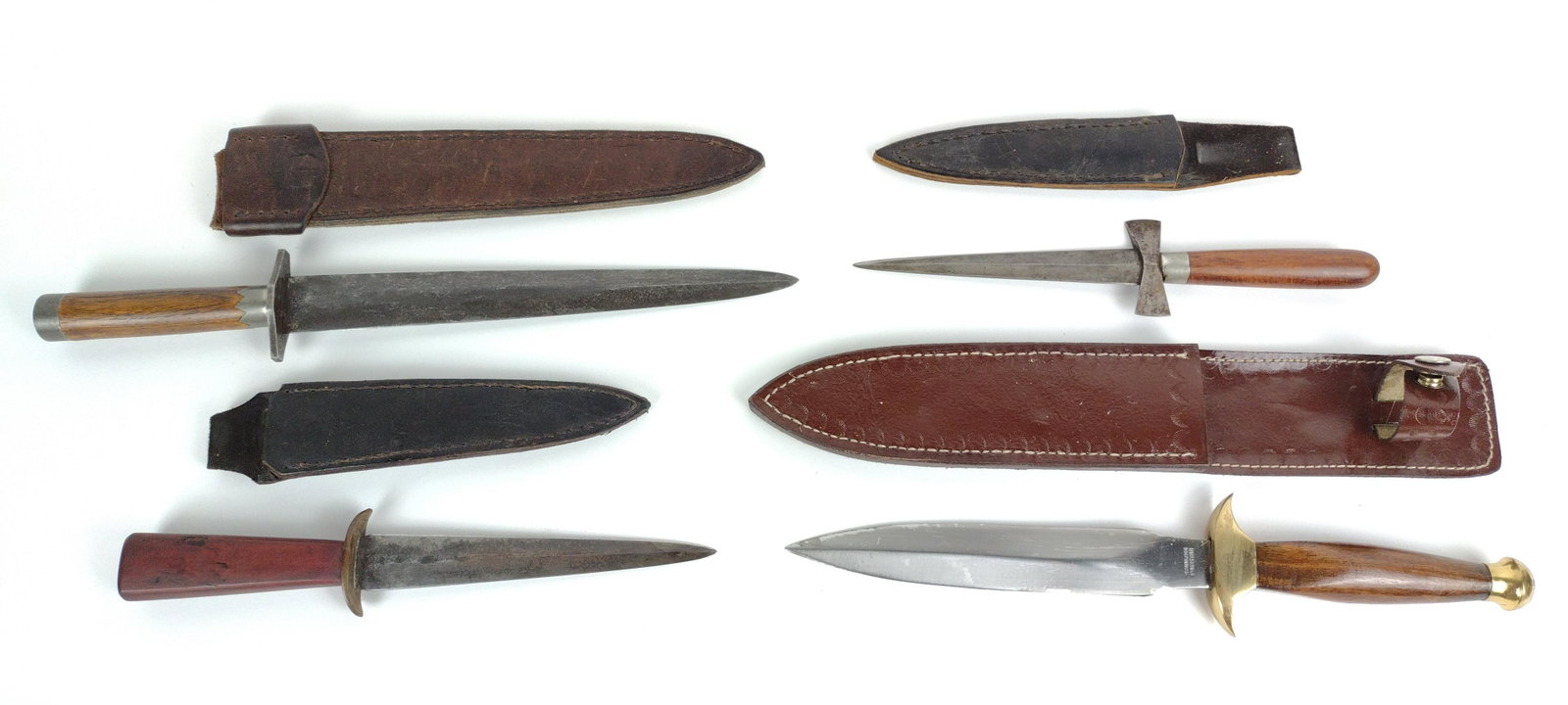 4 Daggers: All with leather sheaths. 11-3/4" to 15-1/2" long. From the Estate of Stephen Pancoe, York Haven, PA. IMPORTANT: Before bidding, please read the terms and conditions. When you registered for the aucti