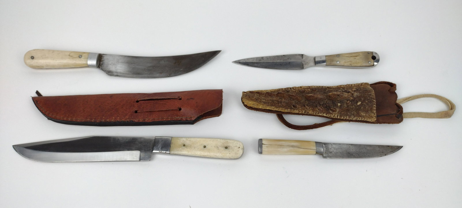 4 Bone-Handled Knives: With one leather and one alligator skin sheath. 8-1/2" to 13" long. From the Estate of Stephen Pancoe, York Haven, PA. IMPORTANT: Before bidding, please read the terms and conditions. When you registe