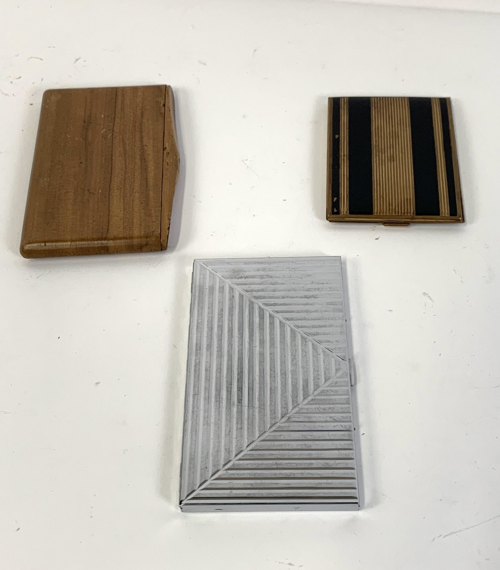 3 Cigarette Cases Incl Elgin: 3-3/4” high to 5-1/4” high. From the Estate of Stephen Pancoe, York Haven, PA. IMPORTANT: Before bidding, please read the terms and conditions. When you registered for the auction you agre