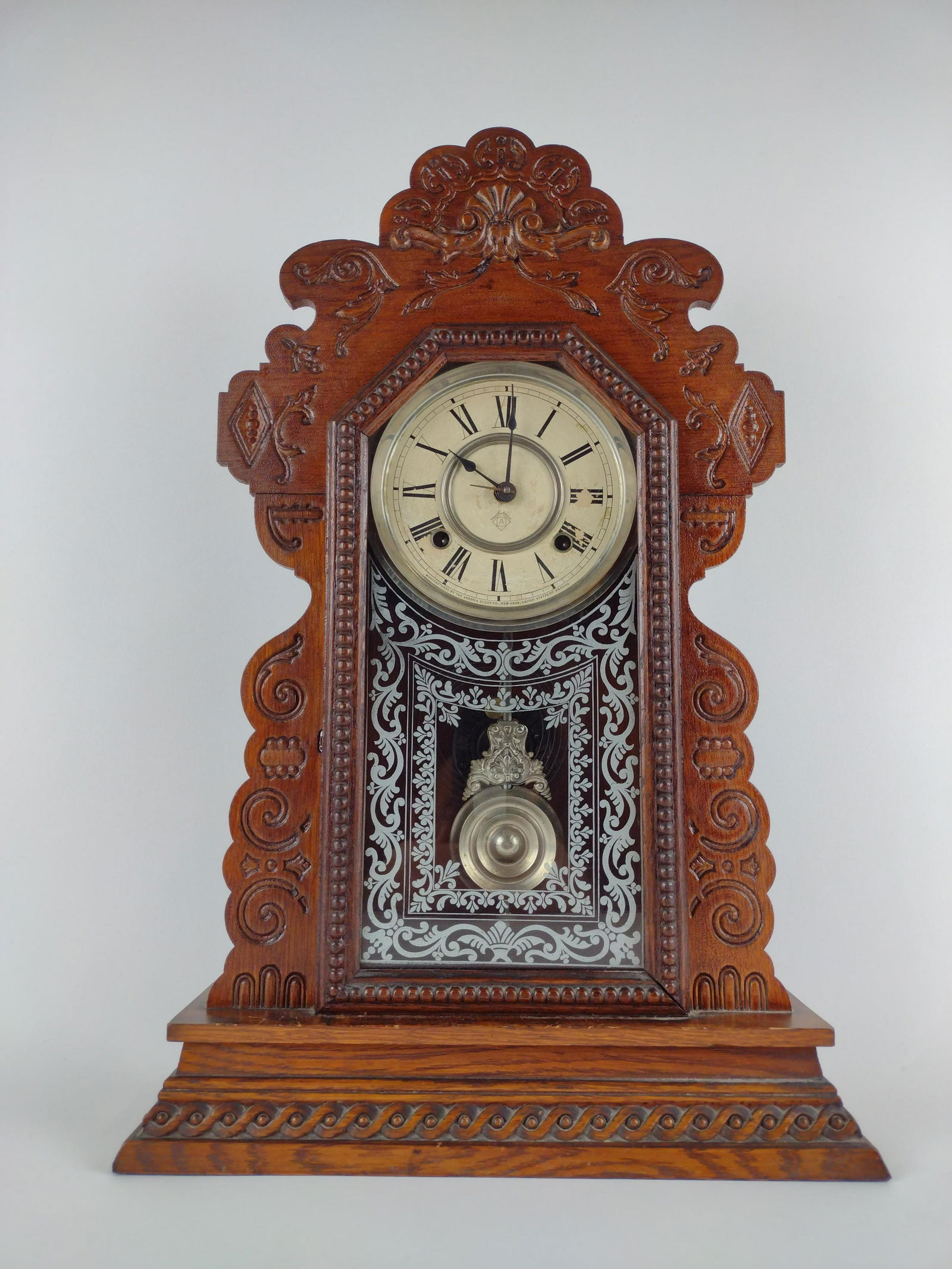 Ansonia Mantel Clock: 14-1/2" wide X 5” deep X 22" high. Starts and stops. Left spring broken. IMPORTANT: Before bidding, please read the terms and conditions. When you registered for the auction you agreed to these