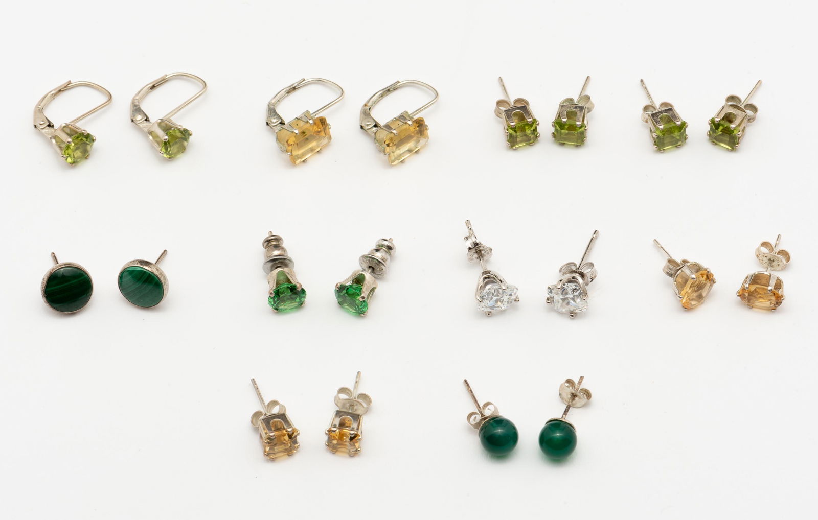 10 Pairs of Sterling Earrings: Includes citrine, peridot, colored CZ and malachite. Most studs, all pierced. IMPORTANT: Before bidding, please read the terms and conditions. When you registered for the auction you agreed to these t