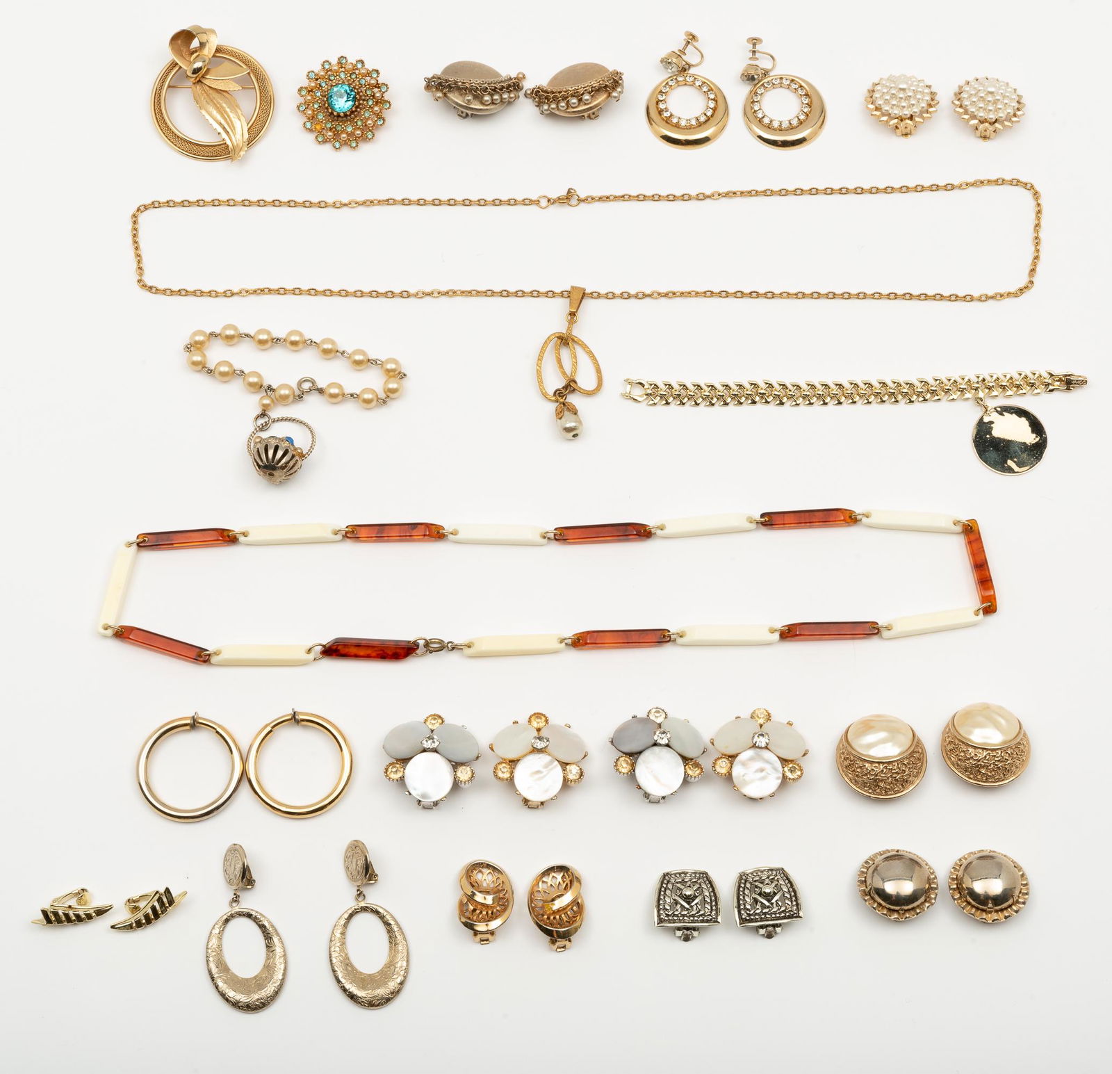 19 Pieces Vintage Costume Jewelry: Including Coro, Kafin, Marino and Bakelite. Necklace 26" long. Rhinestone brooch 1-1/2". IMPORTANT: Before bidding, please read the terms and conditions. When you registered for the auction you agreed