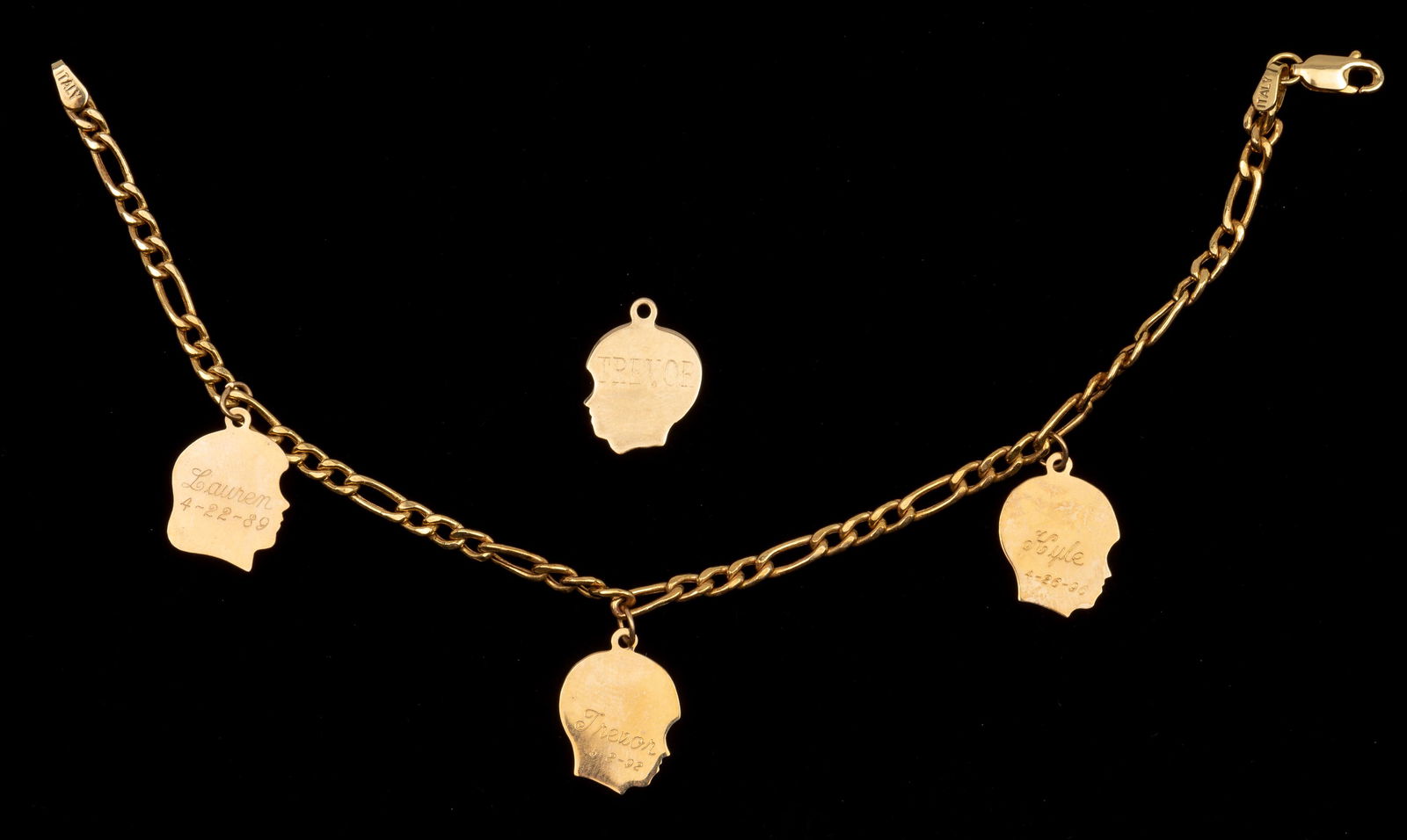 14K Charm Bracelet: Mothers charm bracelet with children profiles and birthdates. 8" long. 3.1 dwt. IMPORTANT: Before bidding, please read the terms and conditions. When you registered for the auction you agreed to these