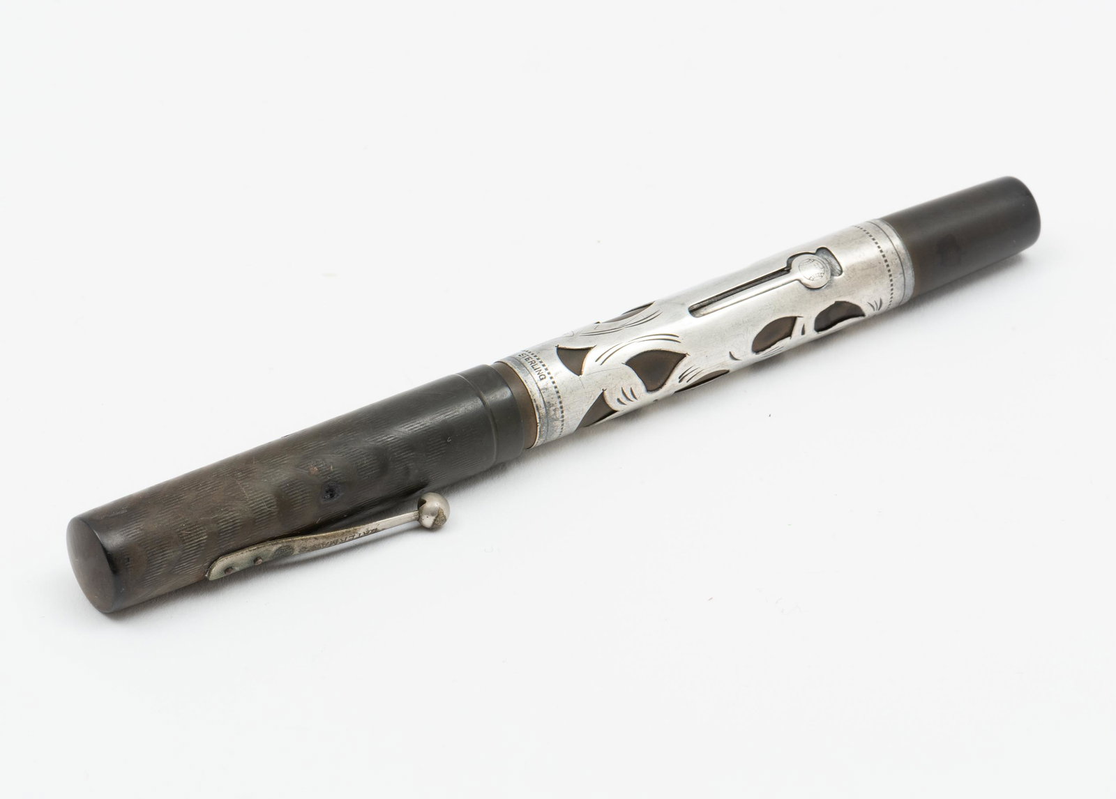 Waterman Fountain Pen: Sterling case. 5-3/8" long. IMPORTANT: Before bidding, please read the terms and conditions. When you registered for the auction you agreed to these terms and will be required to comply with them.