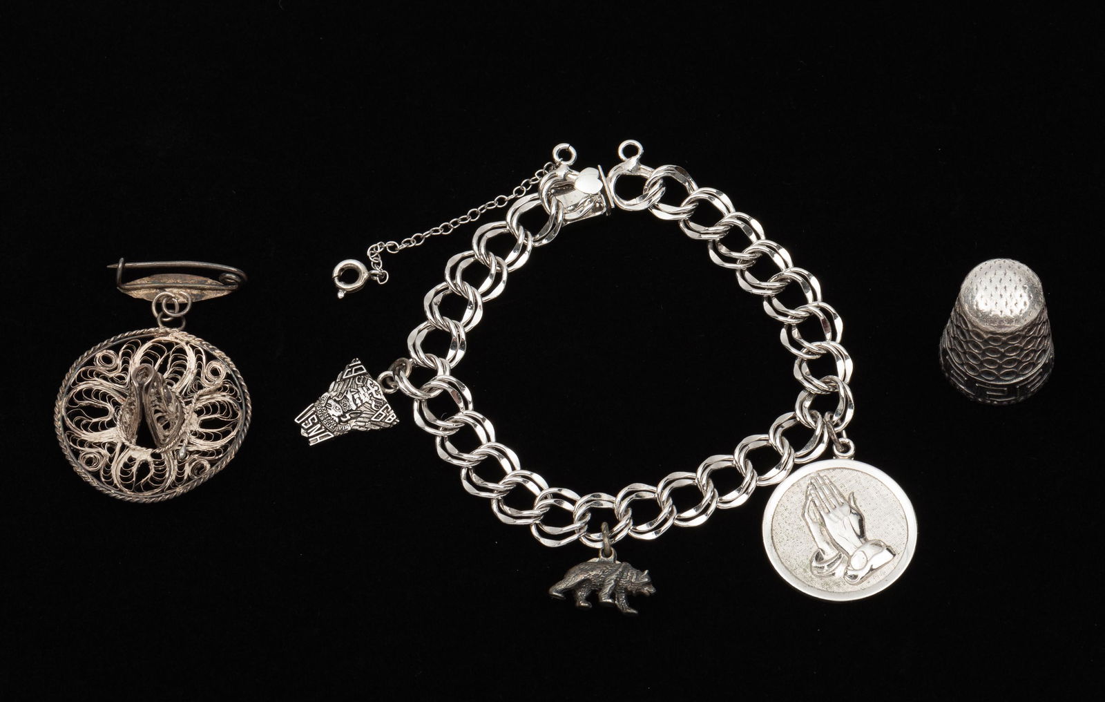 Sterling Charm Bracelet, Brooch, Thimble: Elco bracelet 7" long. Brooch 1-1/2" long. IMPORTANT: Before bidding, please read the terms and conditions. When you registered for the auction you agreed to these terms and will be required to comply