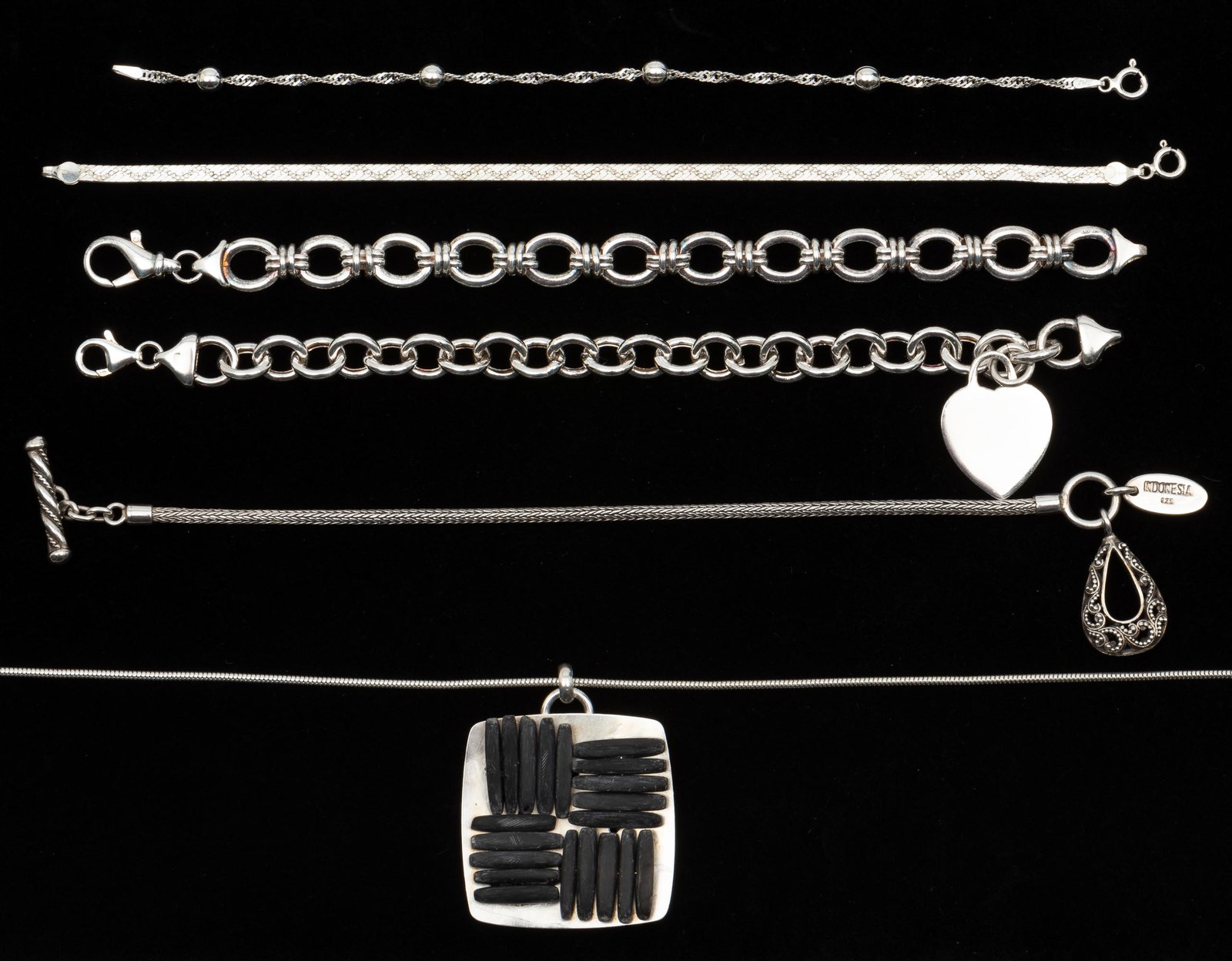 5 Pcs Sterling & Silver Jewelry: Marjorie Baer silver on copper necklace 18" long. Marke Wasserman sterling bracelet with heart charm 7-1/2" long. Lois Jill bracelet with teardrop charm 7" long. IMPORTANT: Before bidding, please read