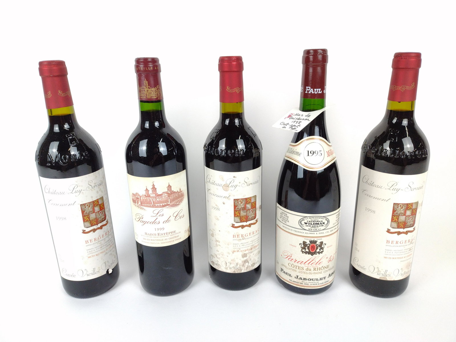 5 Estate Bottles of French Red Wine: 1995-1999. Includes Chateau Puy-Servain Bergerac. Some wear and spotting to labels. THIS LOT IS FACTORY SEALED. AVAILABLE FOR PICK UP ONLY. MUST BE 21 YEARS OF AGE. SHIPPING NOT AVAILABLE. DM IMPORTAN