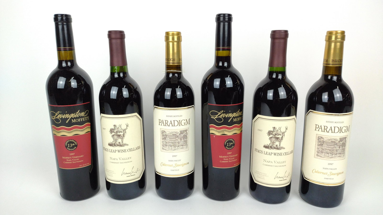 6 Estate Bottles California Red Wine: All 1997. Includes Paradigm, Stag's Leap, and Livingston Moffett Cabernets. THIS LOT IS FACTORY SEALED. AVAILABLE FOR PICK UP ONLY. MUST BE 21 YEARS OF AGE. SHIPPING NOT AVAILABLE. DM IMPORTANT: Befor