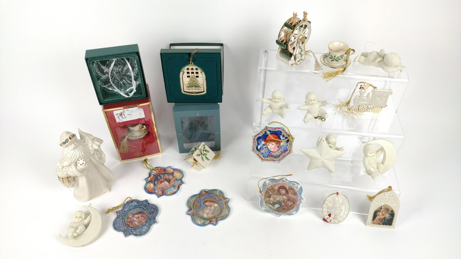 21 Christmas Ornaments incl Lenox: Glass and resin. Also includes Waterford, Edna Hibel, and Dept. 56 Snowbabies. 1-3/4" to 6-1/2" high. IMPORTANT: Before bidding, please read the terms and conditions. When you registered for the aucti