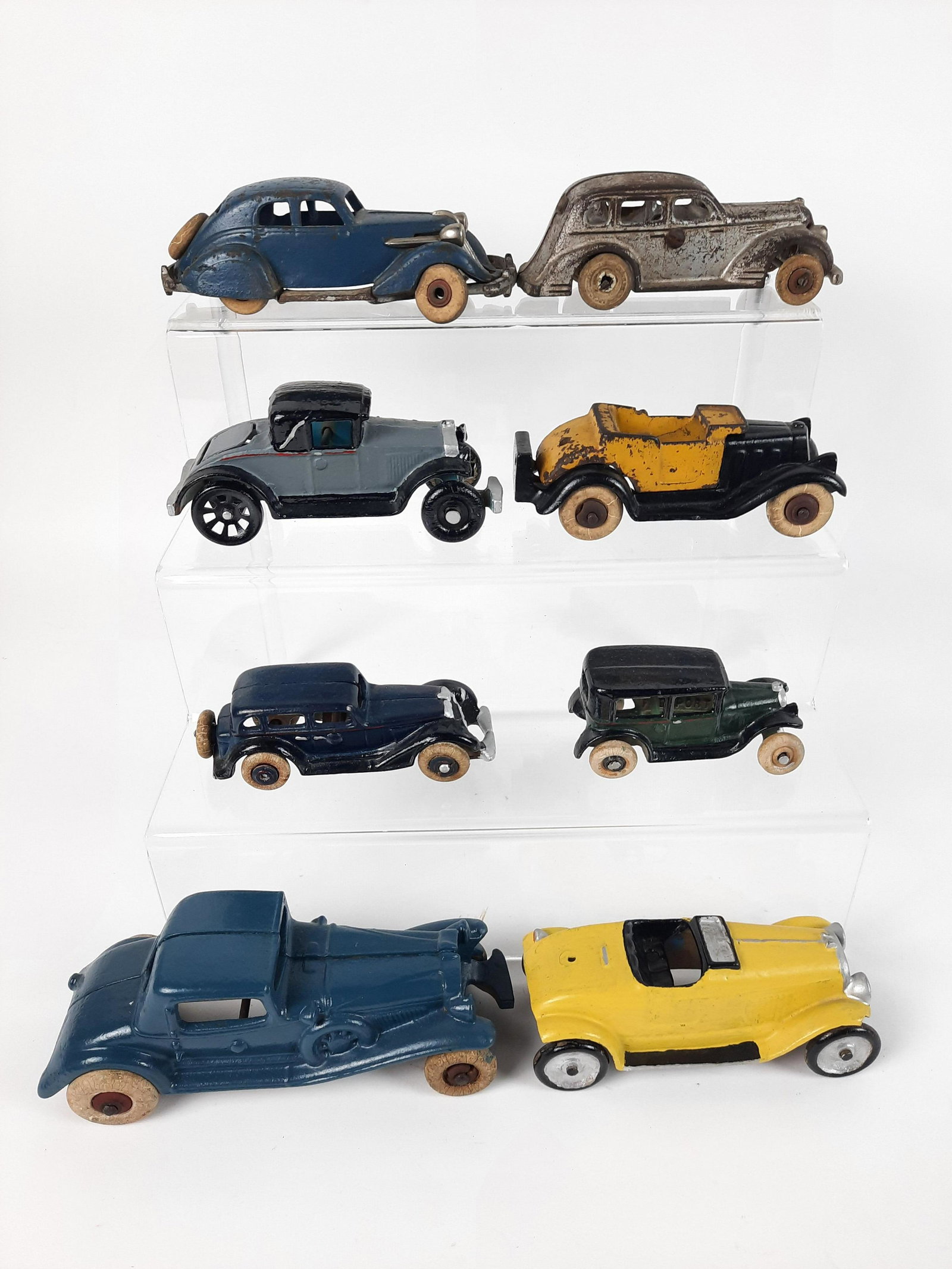 8 Vintage Cast Iron Cars incl Arcade Pontiac: 4" to 7-1/4" long. Some paint and wheel losses. LR IMPORTANT: Before bidding, please read the terms and conditions. When you registered for the auction you agreed to these terms and will be required t
