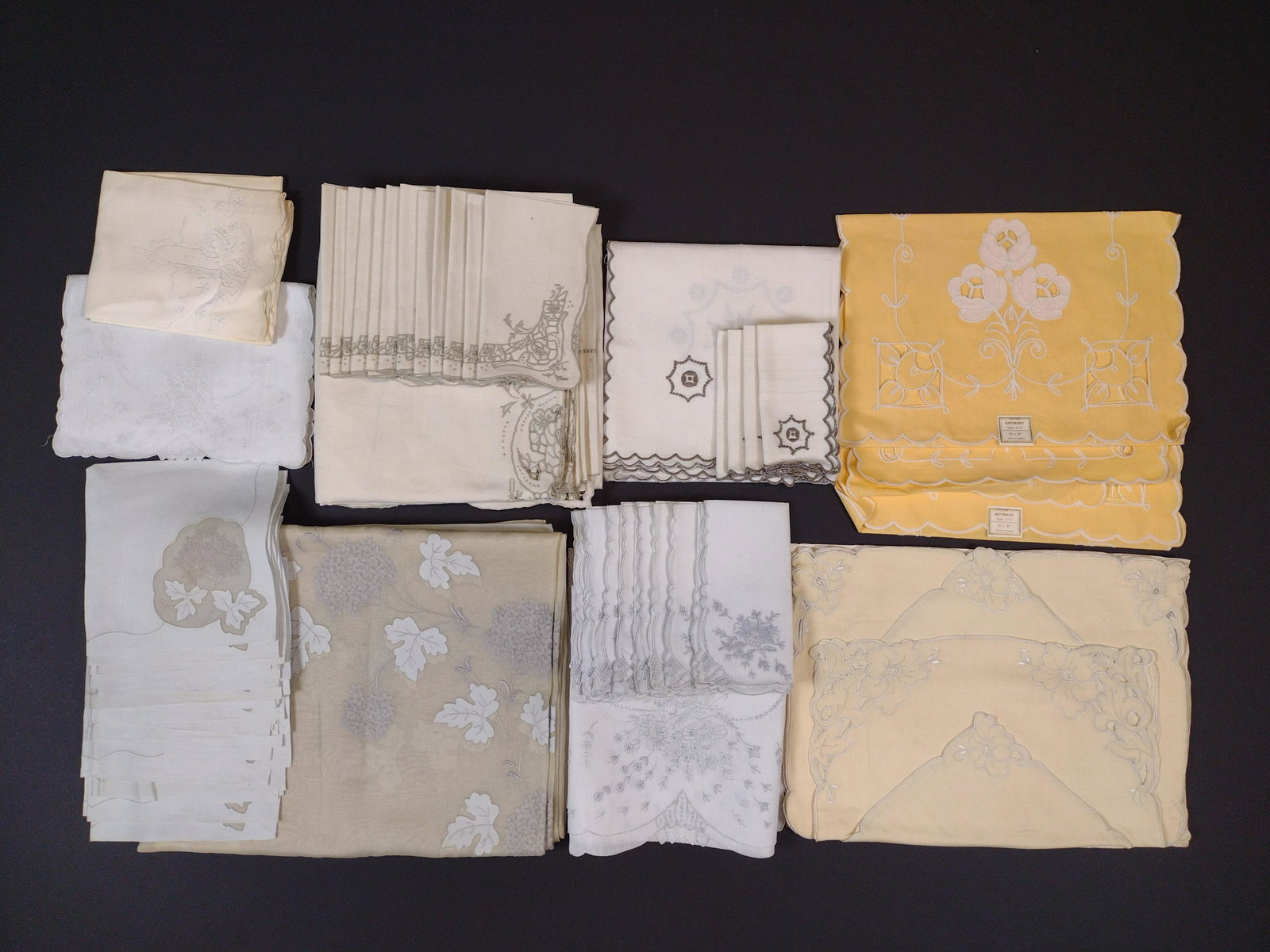 45 Vintage Table Linens incl Embroidery: 9" to 68" wide x 9" to 110" long. Some minor staining and discoloration. LR IMPORTANT: Before bidding, please read the terms and conditions. When you registered for the auction you agreed to these ter