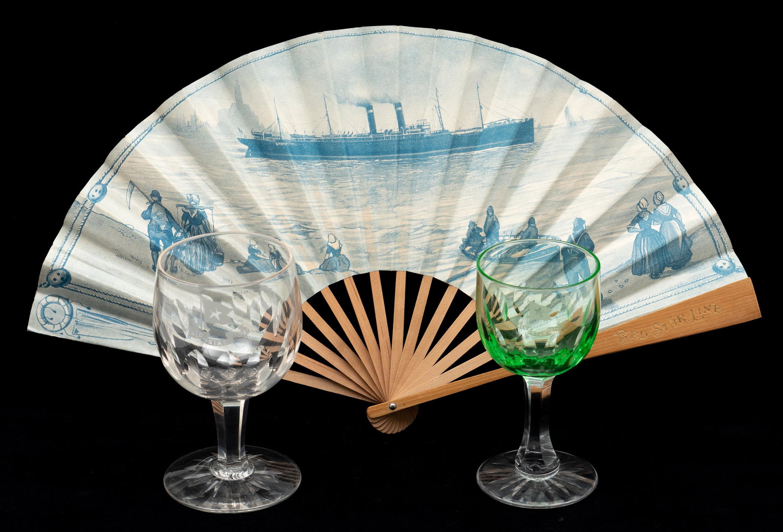 3 Red Star Line Items: Includes green wine glass with Red Star Line logo, clear wine glass with Red Star Line logo, and Red Star Line Antwerp - New York hand fan. Glasses 4-3/4" high to 5" high. IMPORTANT: Before bidding, p