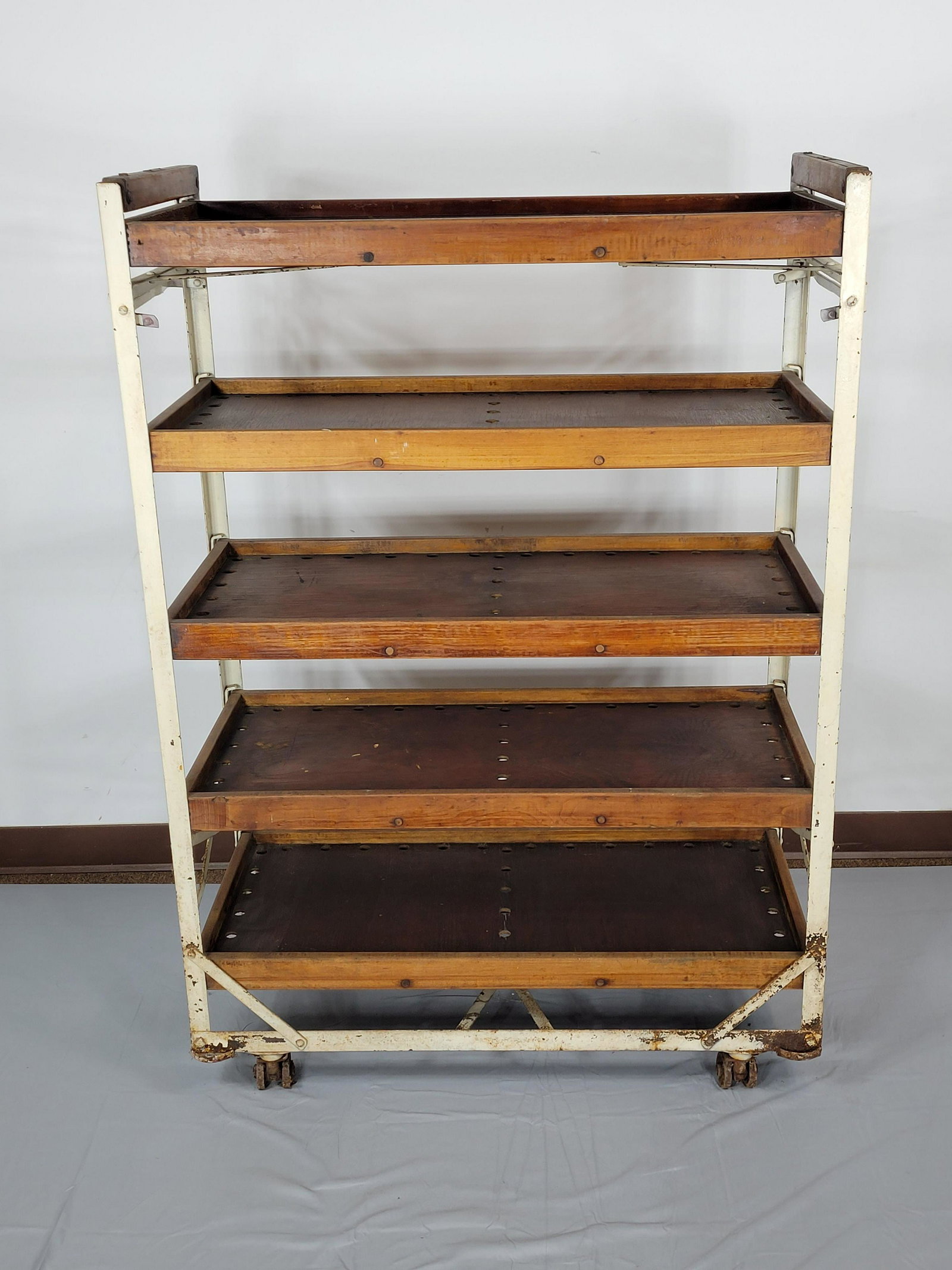 Industrial Wood And Iron Cart by Neverax: 28" wide X 17 1/2" deep X 54" high. Has paint loss and rust to metal. Wood has some discoloring. MG. IMPORTANT: Before bidding, please read the terms and conditions. When you registered for the auctio