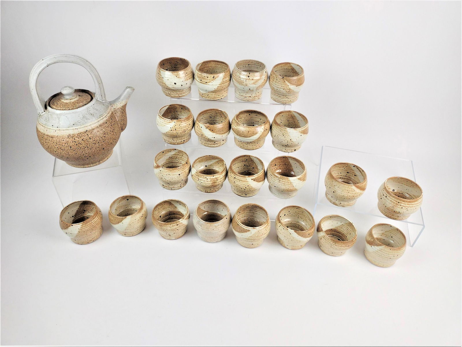 23 Pcs Nina Ray Tea Cups and Pot: 3-1/2" to 8-3/4" wide x 3" to 9-1/2" high. LR