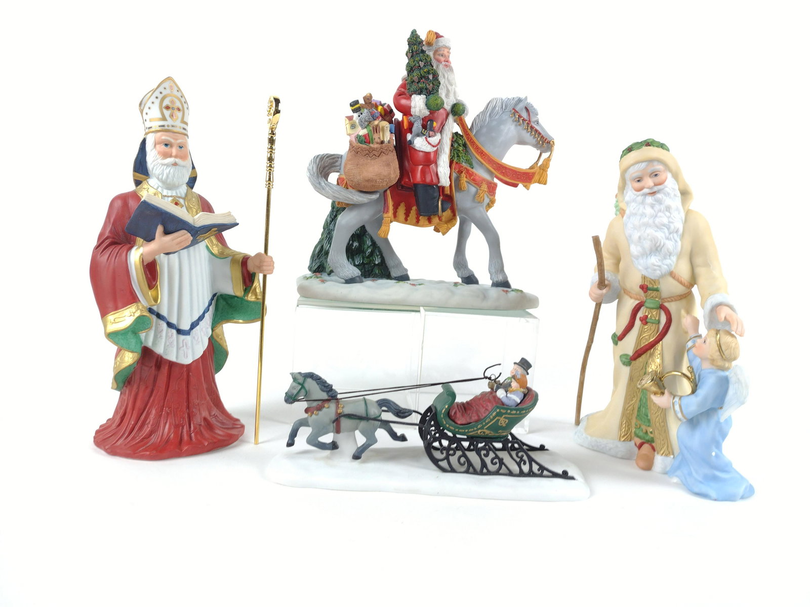 3 Lenox Santa's and 1 Heritage Sleigh Rider: 3 1/2" tall to 10 1/2" tall. JK MPORTANT: Before bidding, please read the terms and conditions. When you registered for the auction you agreed to these terms and will be required to comply with them.