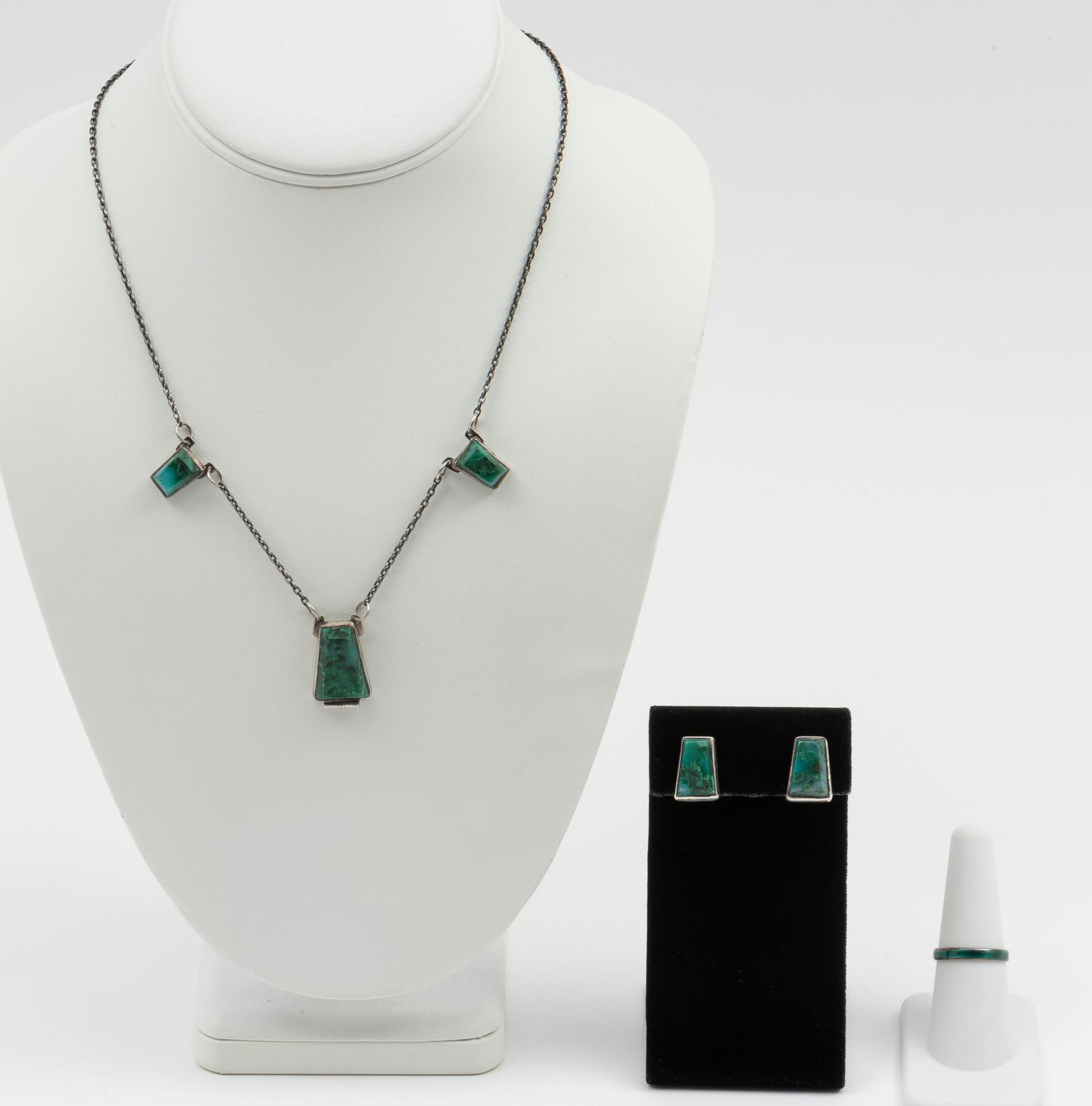 3 Pcs Sterling Jewelry: Sterling and green onyx necklace 18" long with matching screwback earrings 5/8" high. Ring with green enamel marked Siam 925 Sterling, size 7.5. IMPORTANT: Before bidding, please read the terms and co