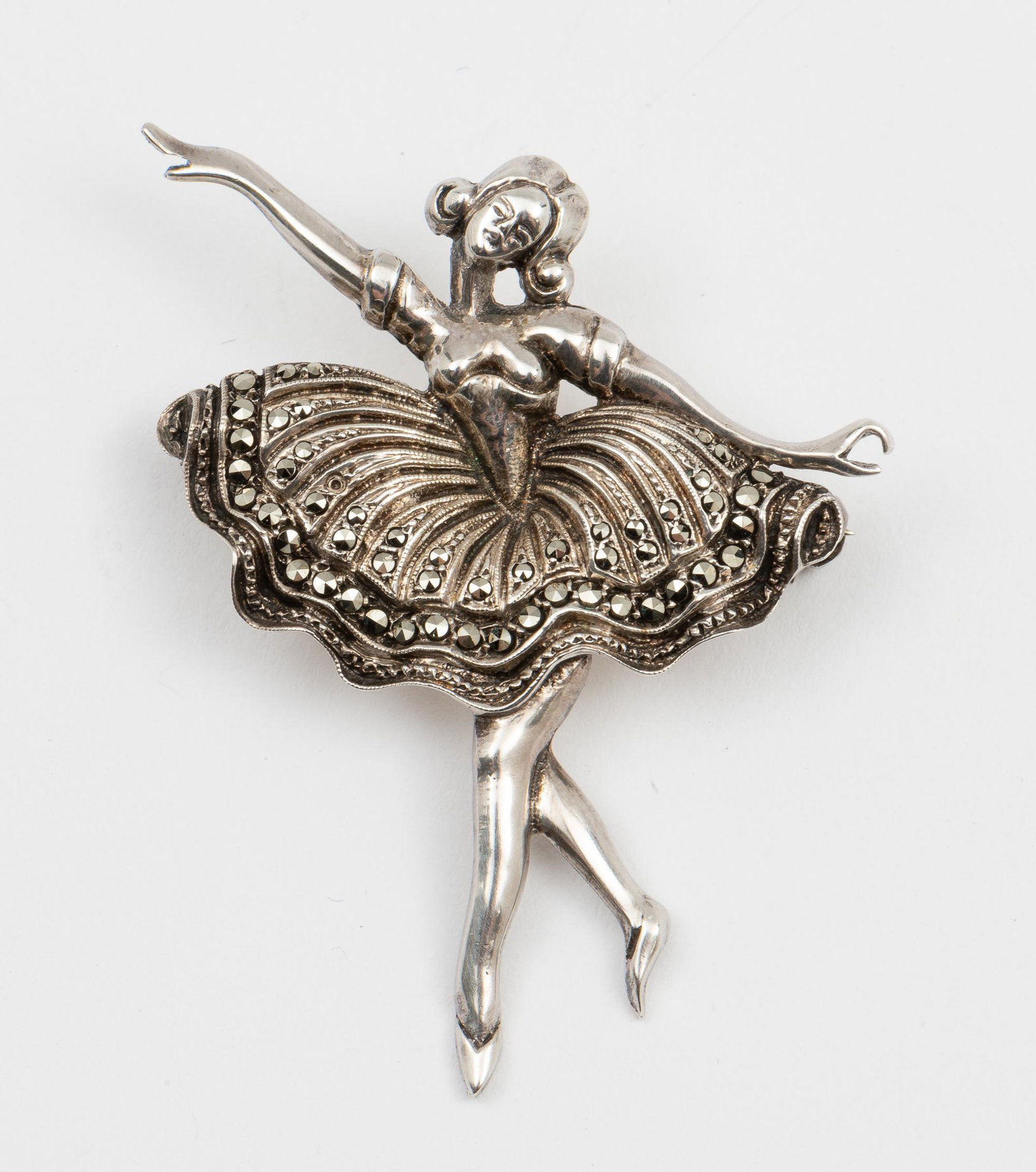 Sterling Marcasite Ballerina Pin: 2" high x 1-5/8" wide. IMPORTANT: Before bidding, please read the terms and conditions. When you registered for the auction you agreed to these terms and will be required to comply with them.