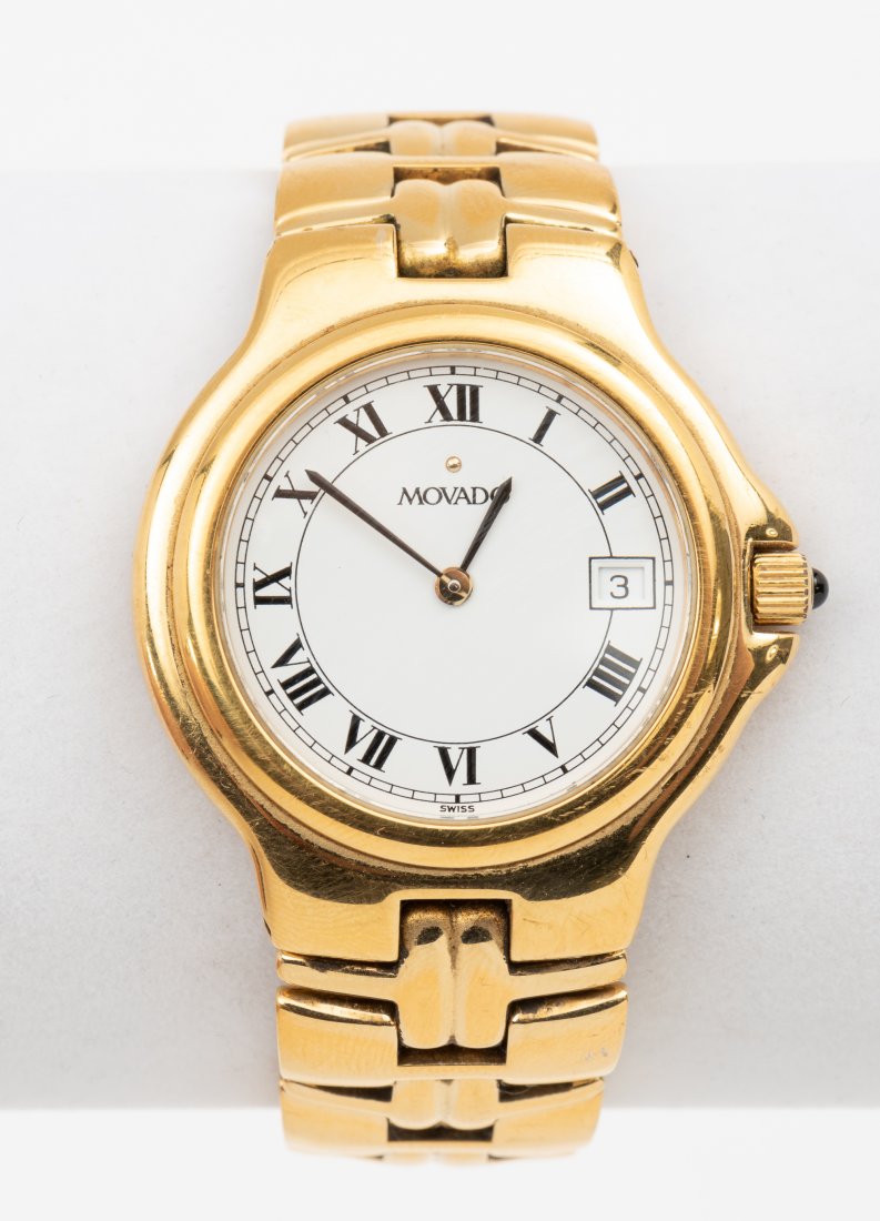 Movado Ladies Wrist Watch: Stainless steel case and band. Model 88.E2.887.2 and serial number 3036821. 1-1/2" lug to lug. 4-1/8" long open. Running. Includes original box. IMPORTANT: Before bidding, please read the terms and co