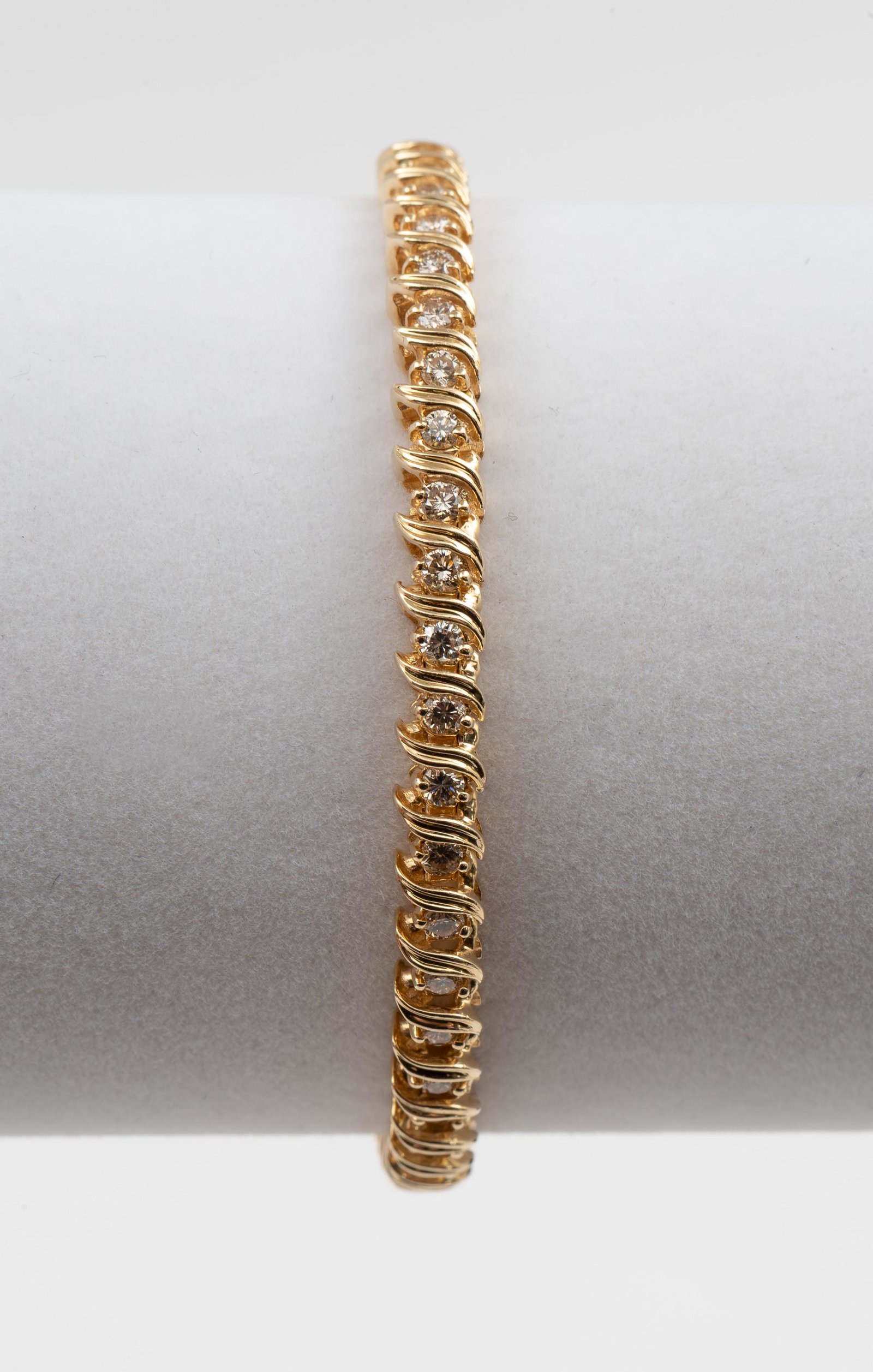 14K 1.41 CTW Diamond Tennis Bracelet: 14k stamped tennis bracelet set with forty-seven approximately .03 carat each diamonds, 1.41 CTW. Clarity SI2-I1, Color H-I. 7" long. 11.5 dwt. IMPORTANT: Before bidding, please read the terms and con