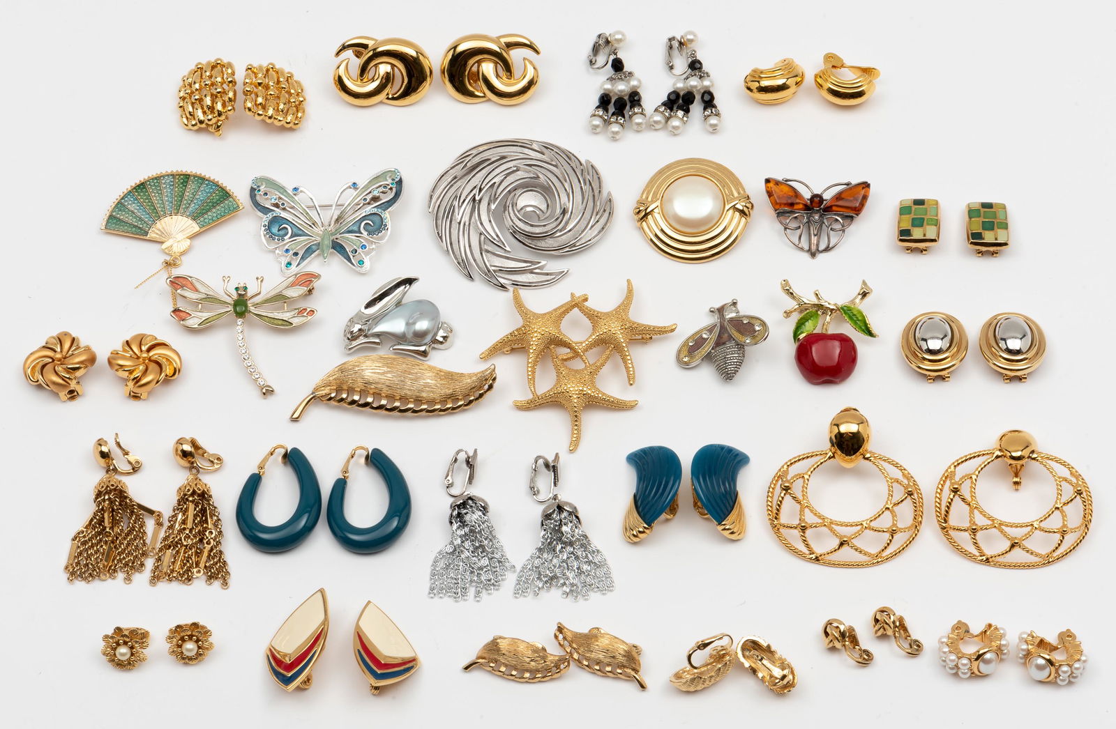 Grouping of Costume Jewelry: Including Trifari, Monet and unsigned. 7/8" to 2-1/2" long. IMPORTANT: Before bidding, please read the terms and conditions. When you registered for the auction you agreed to these terms and will be r