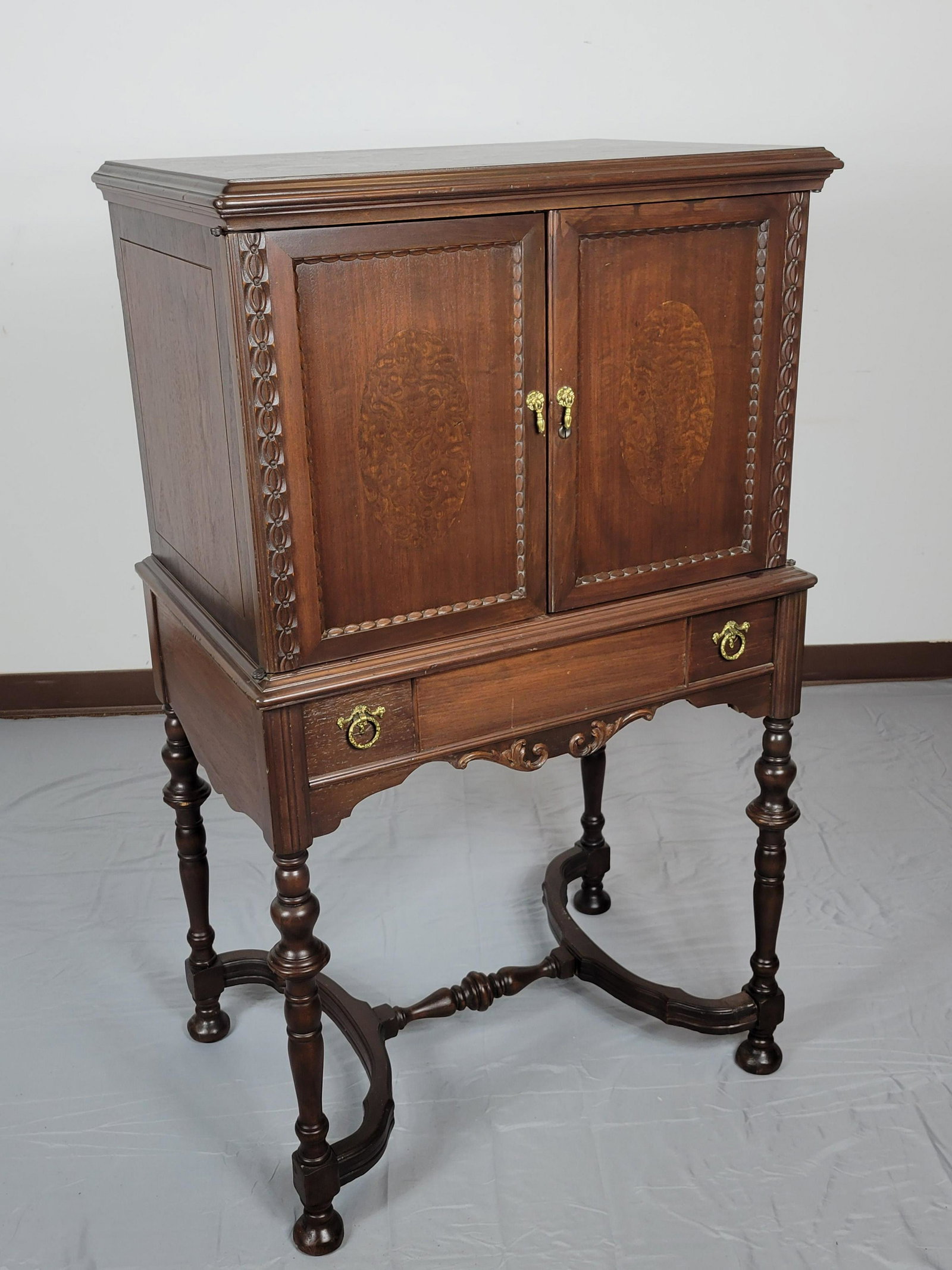 Music Cabinet: 28" wide X 19 1/2" deep X 48" high. Has chips on back leg. MG. IMPORTANT: Before bidding, please read the terms and conditions. When you registered for the auction you agreed to these terms and will b