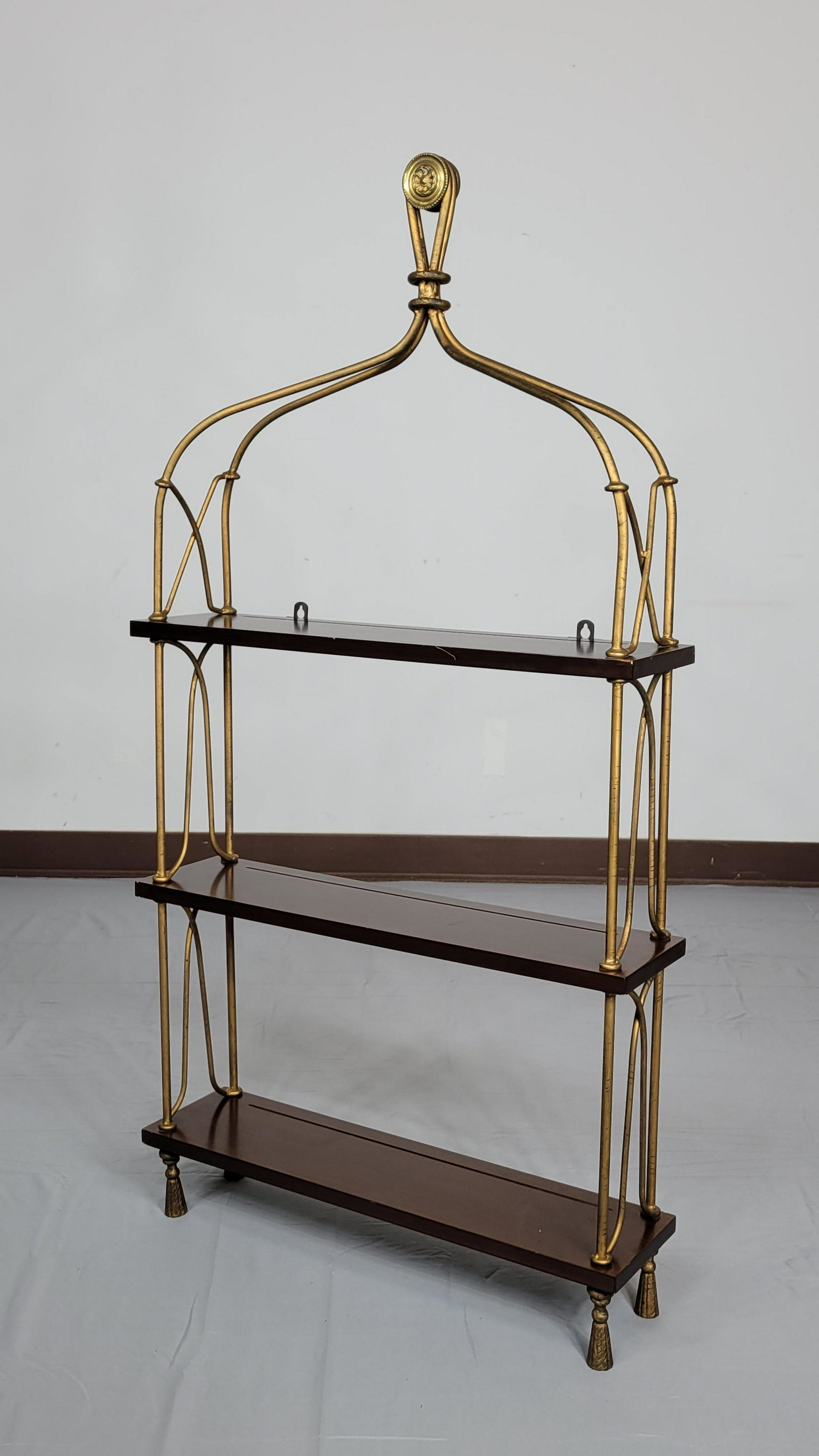 Metal & Wood Wall Etagere: 24" wide X 6" X 47" high. Top shelf has scratch to front. MG. IMPORTANT: Before bidding, please read the terms and conditions. When you registered for the auction you agreed to these terms and will be