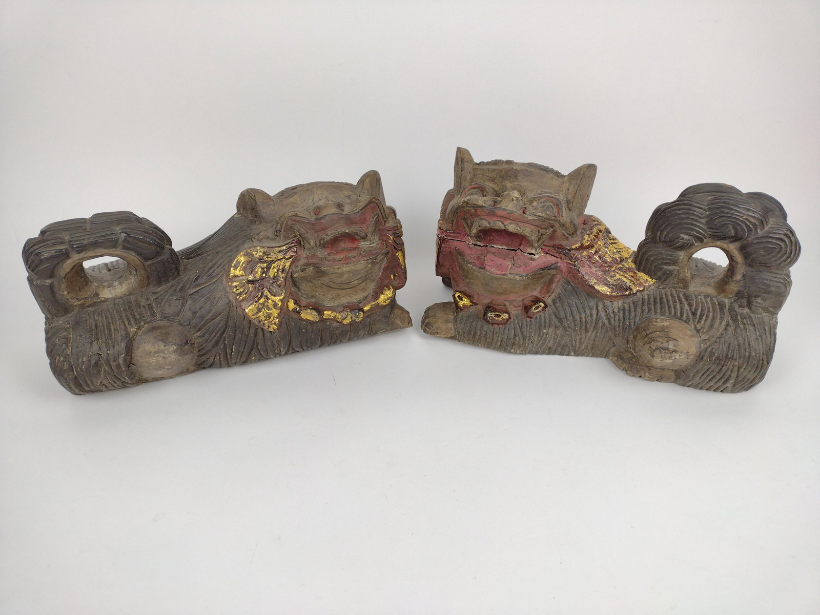 Pair Wooden Foo Dogs: 14" wide x 6" deep x 7" high. Some surface wear consistent with age and use. Some splits to wood. JK IMPORTANT: Before bidding, please read the terms and conditions. When you registered for the auctio