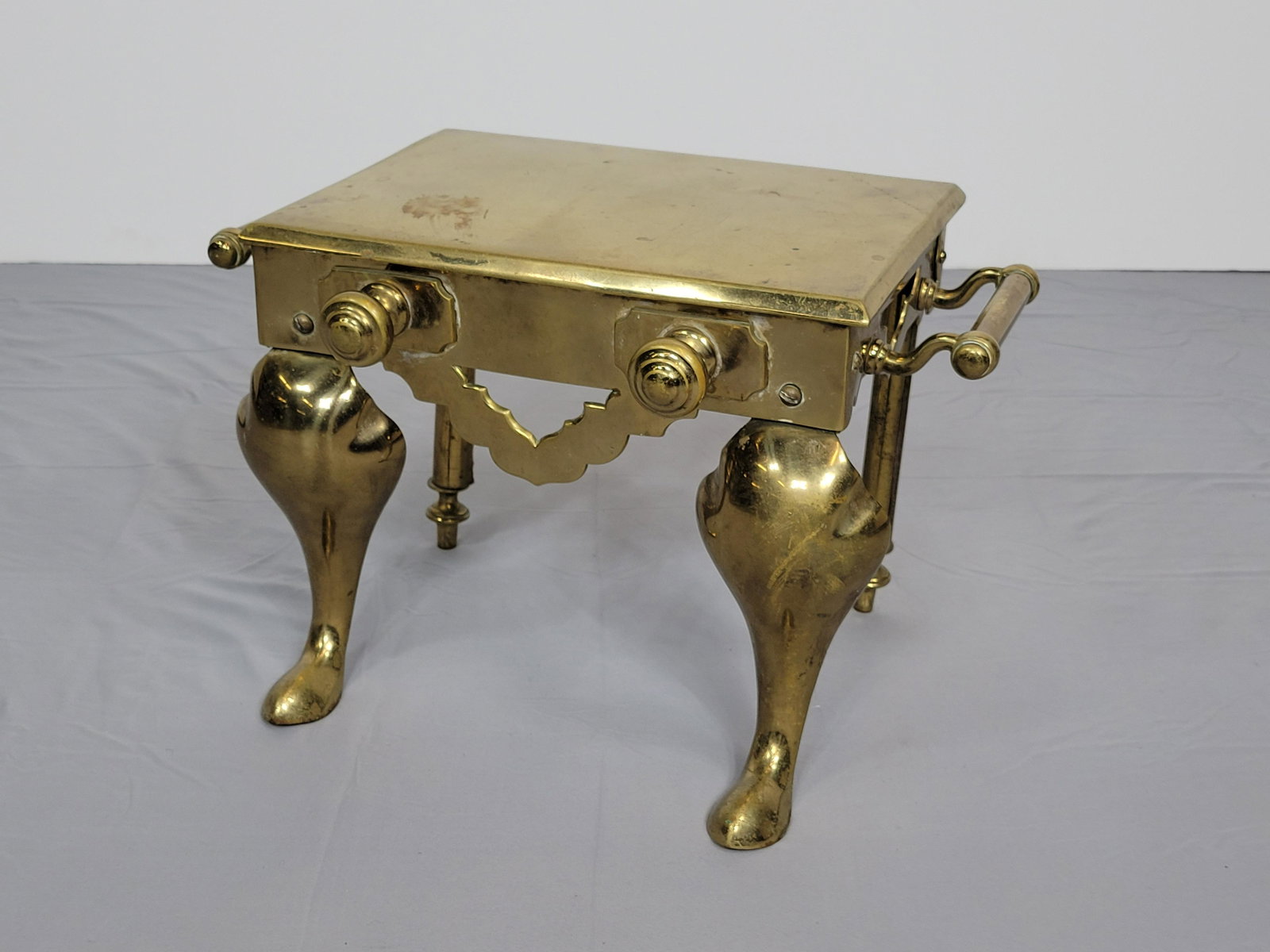 Antique Fireplace Footman: 19" wide X 11 1/2" deep X 12" high. Has finish loss and discoloring. MG. IMPORTANT: Before bidding, please read the terms and conditions. When you registered for the auction you agreed to these terms 