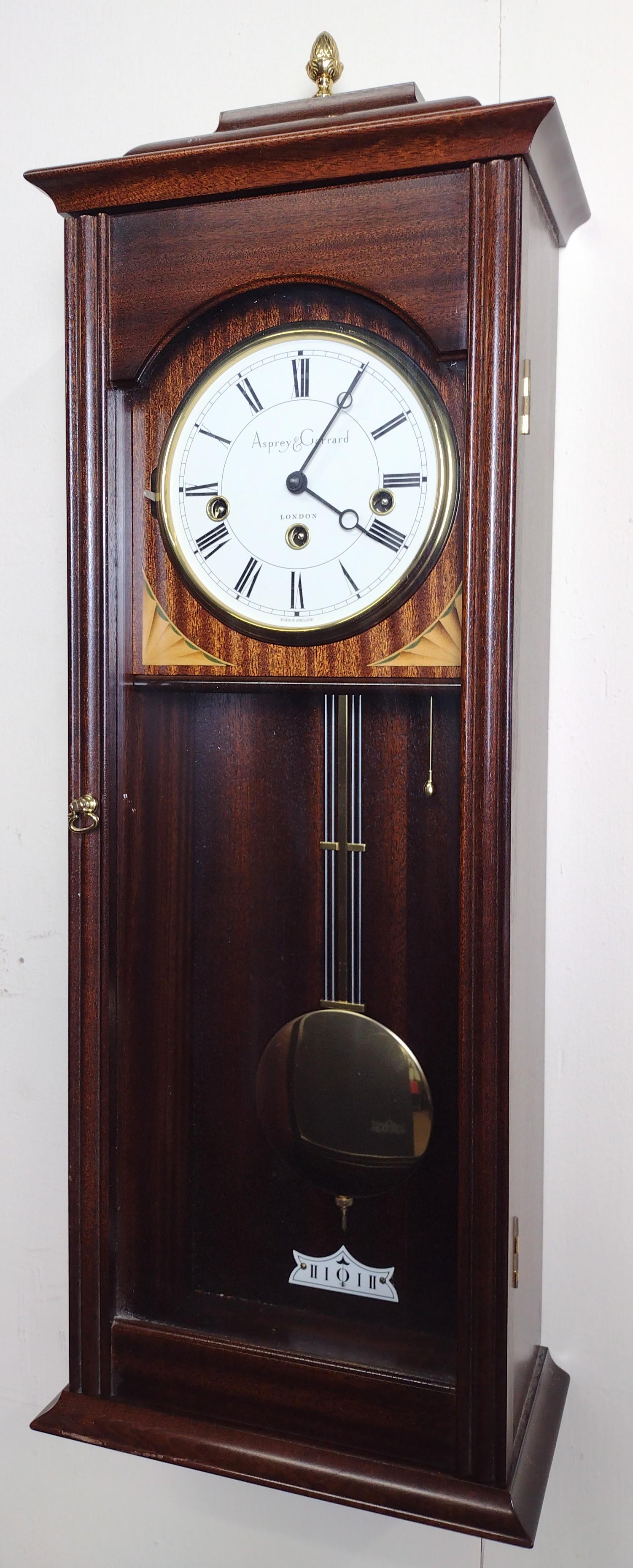 Asprey & Garrard Wall Clock: 9-1/2" wide X 29" high. Starts and stops. DM IMPORTANT: Before bidding, please read the terms and conditions. When you registered for the auction you agreed to these terms and will be required to comp