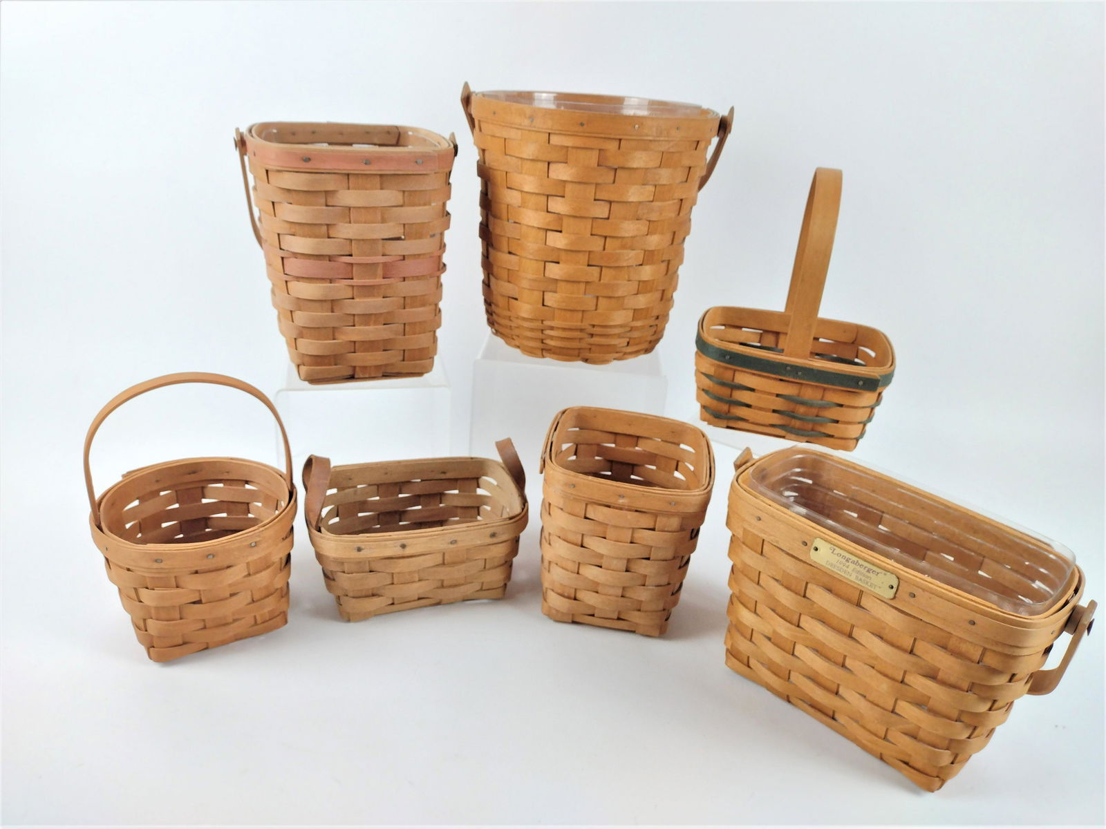 7 Longaberger Baskets: 5 1/2" to 10" wide x 5 1/4" to 9 1/2" deep x 3 1/2" to 9 1/2" high. JK IMPORTANT: Before bidding, please read the terms and conditions. When you registered for the auction you agreed to these terms an