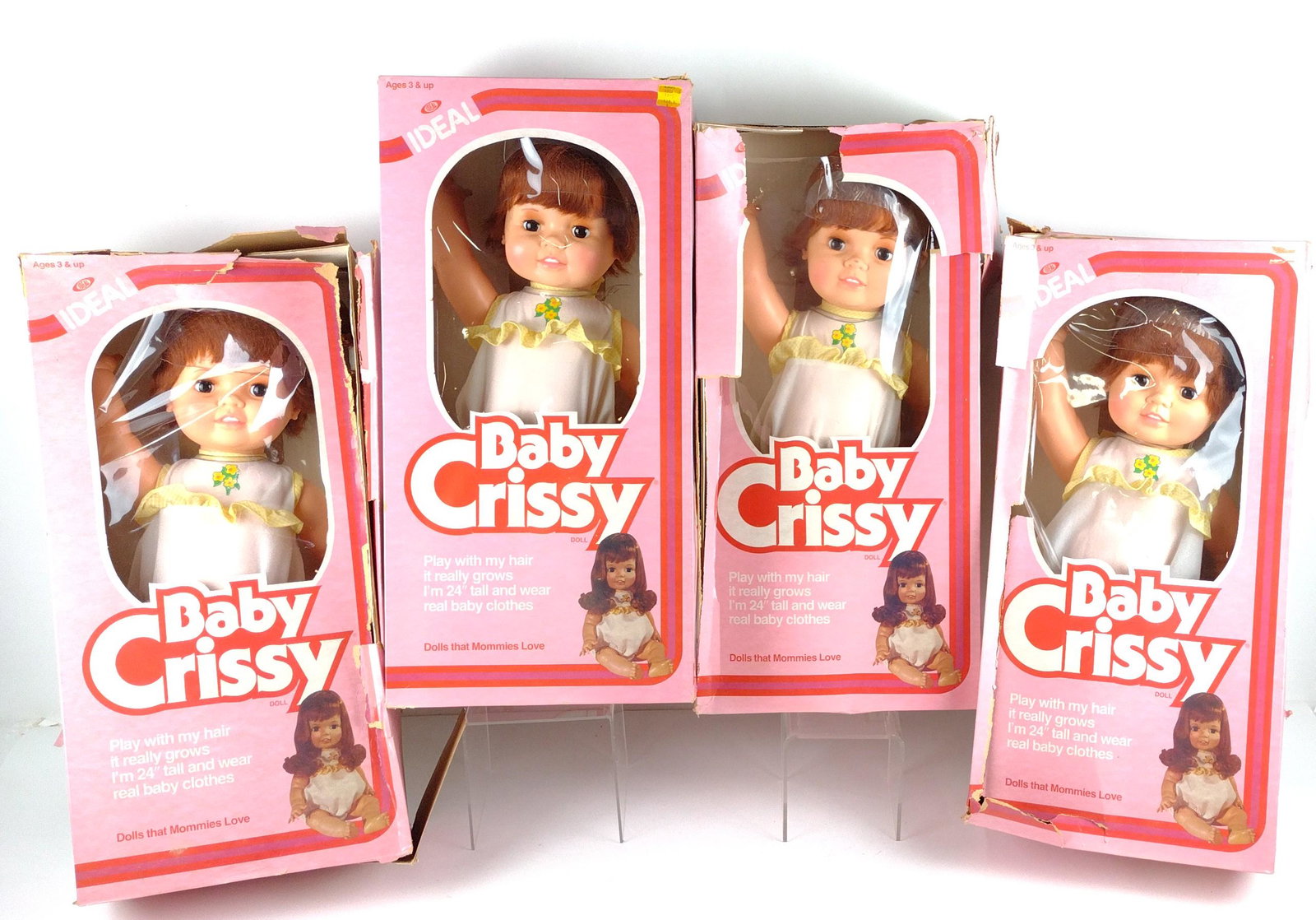4 Baby Crissy Dolls: Manufactured by the Ideal Toy Corporation, 1981, 1973. Style number 8526-6. Includes original boxes. Boxes 24-1/4" high x 12" wide. Dolls 23" high. Heavy wear to boxes. Sold as is. DP. IMPORTANT: Befo