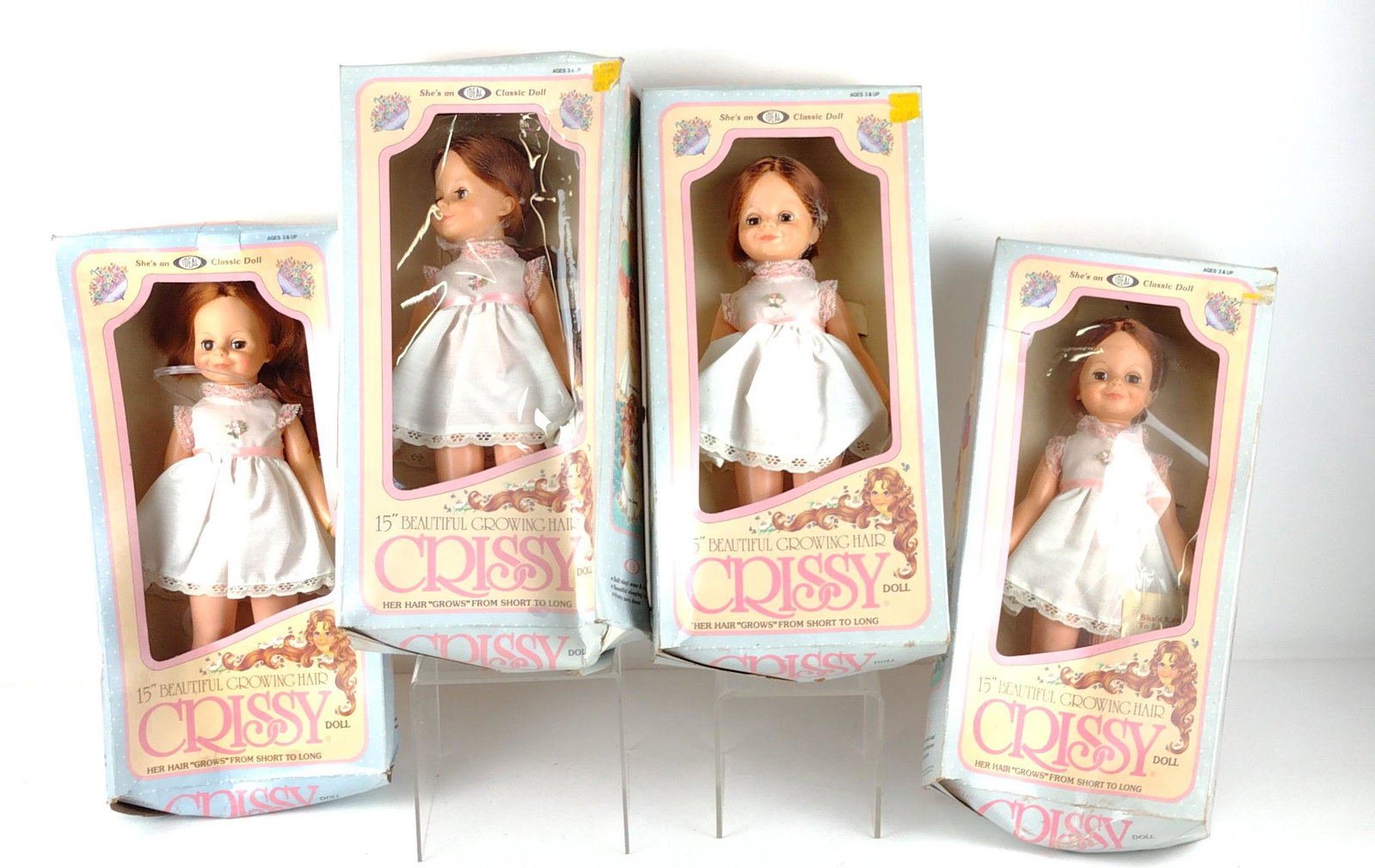 4 Beautiful Growing Hair Crissy Dolls: Manufactured by the Ideal Toy Corporation, 1982. Style number 1030-6. Includes original boxes. Boxes 17-1/4" high x 8-1/2" wide. Dolls 15" high. Heavy wear to boxes. Sold as is. DP. IMPORTANT: Before 
