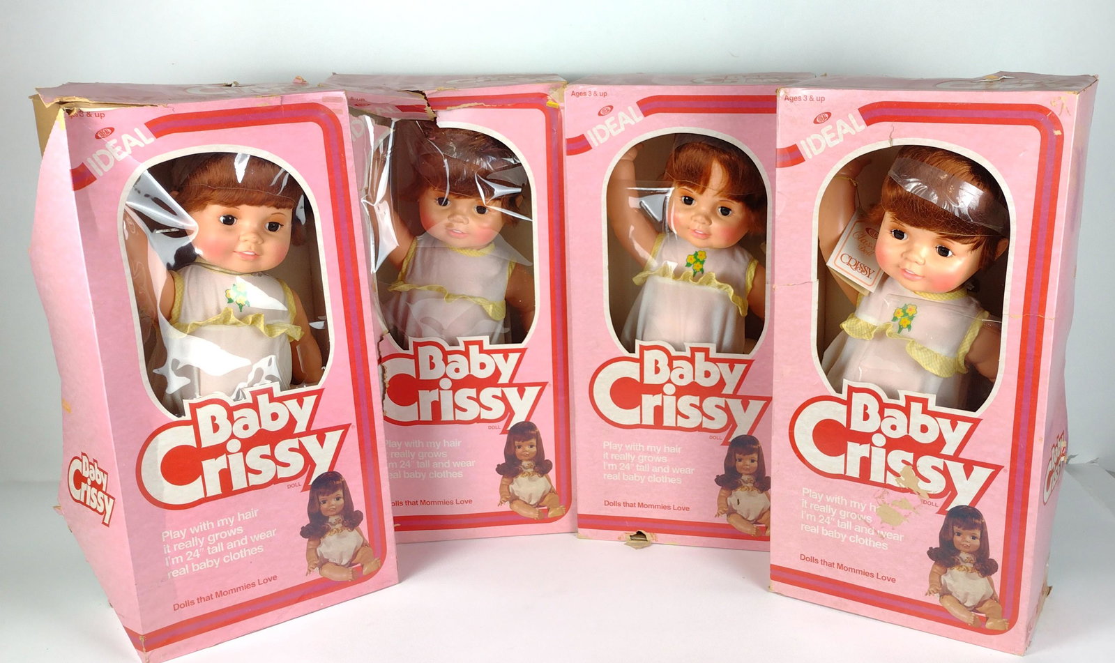 4 Baby Crissy Dolls: Manufactured by the Ideal Toy Corporation, 1981, 1973. Style number 8526-6. Includes original boxes. Boxes 24" high x 12" wide. Dolls 24" high. Wear to boxes. Sold as is. DP. IMPORTANT: Before bidding